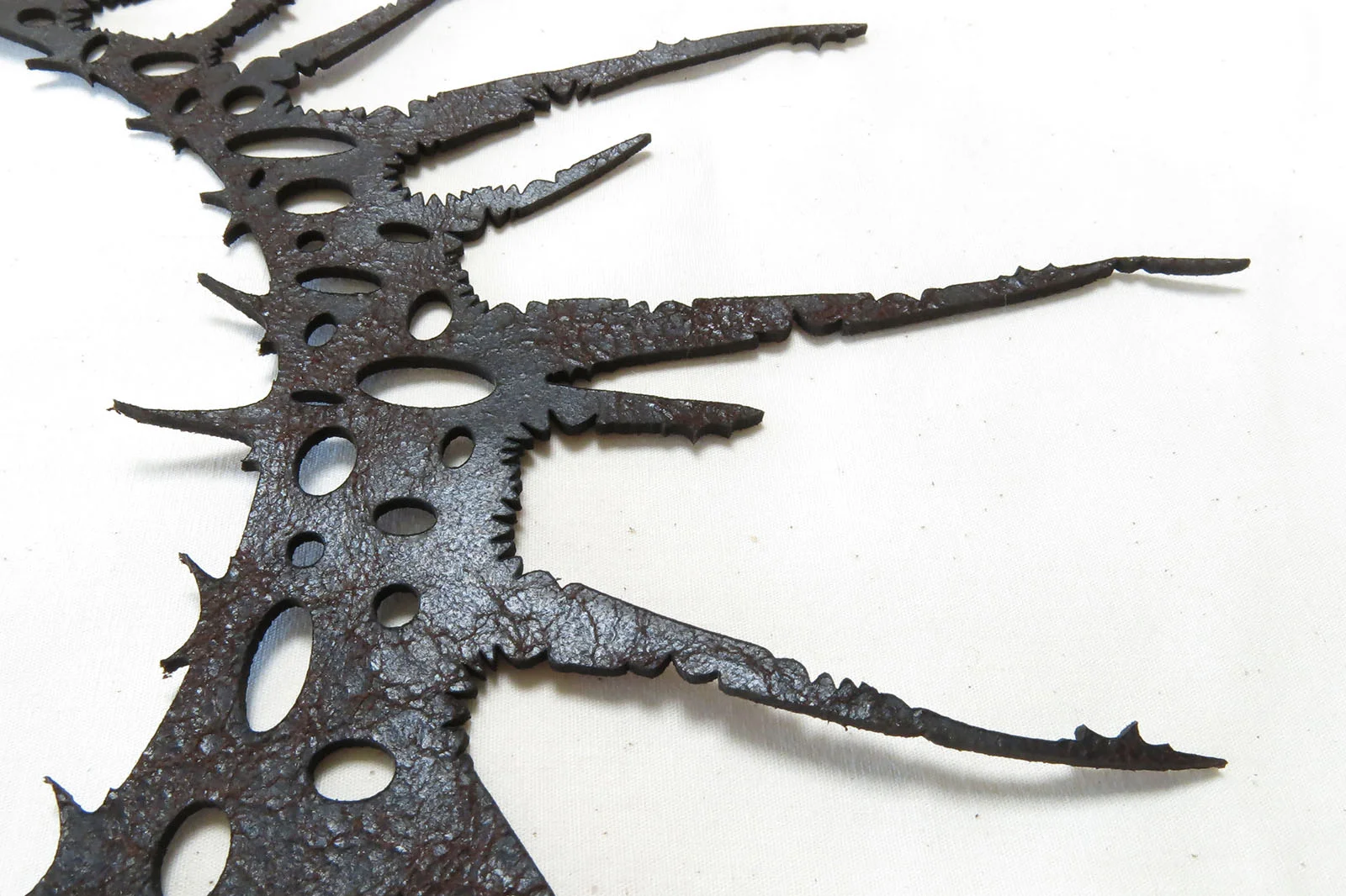 LASER-CUT-LEATHER-NECKLACE-DETAIL-RESIS-ZED.jpg