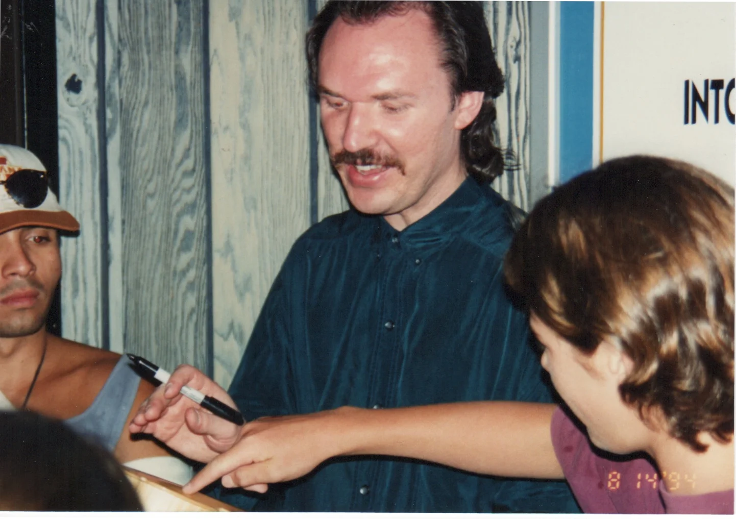 Mark O'Conner autographing the Purpleheart for Toby