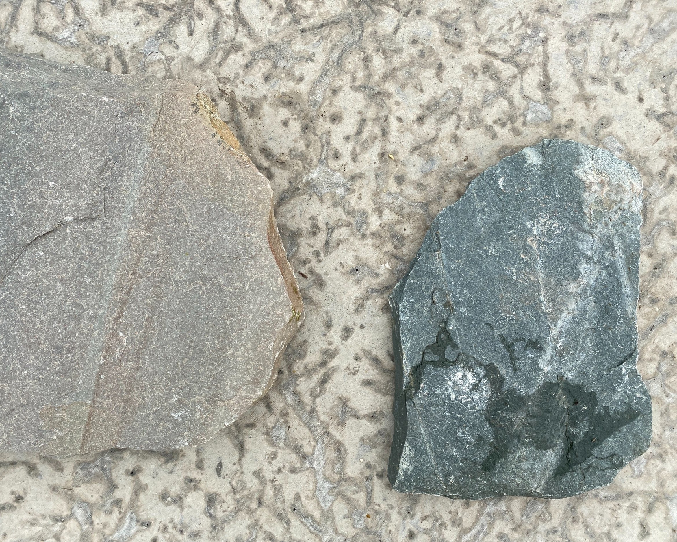 Volcanic Slate (left) Black Granite (right) Tyndall Stone (background)