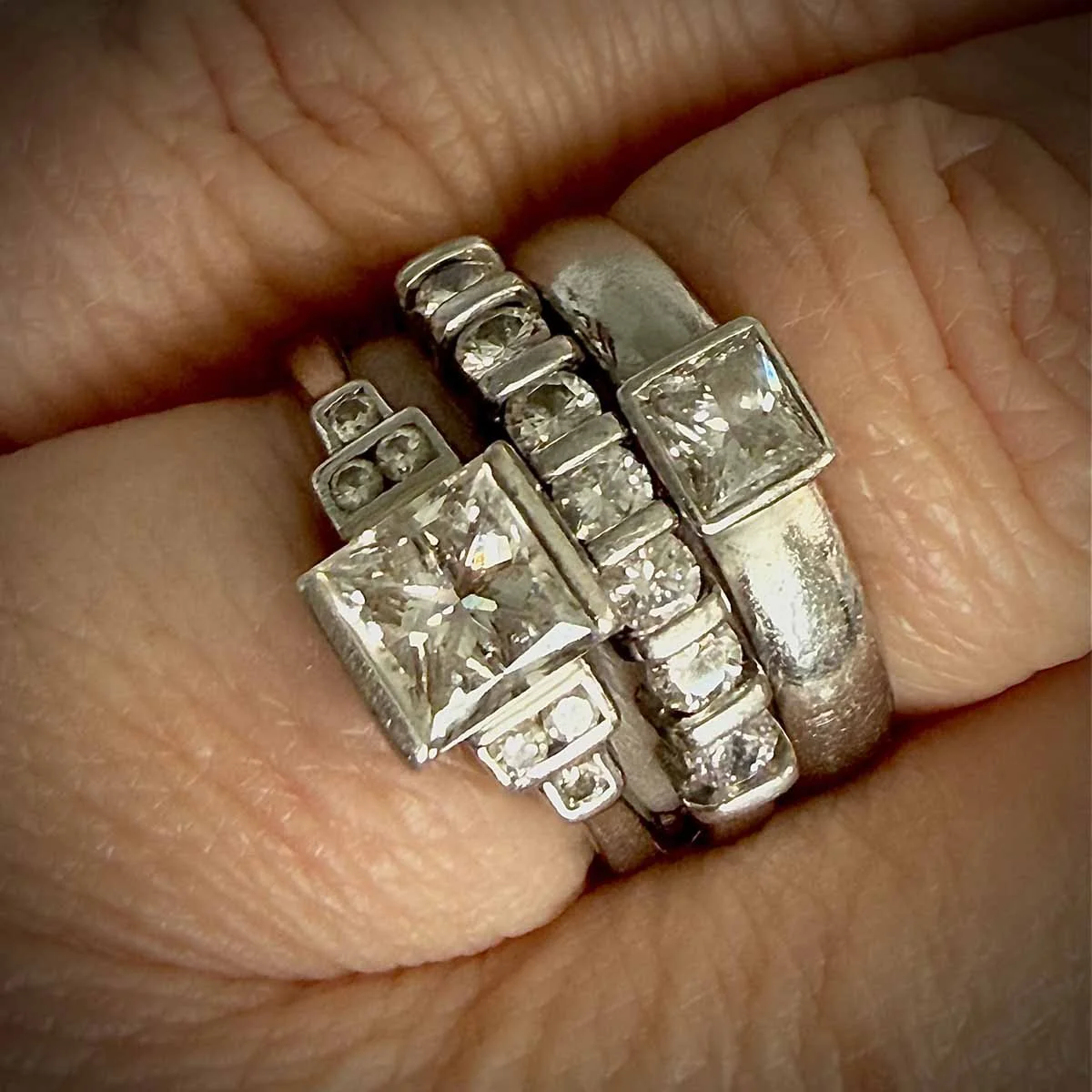 my engagement ring, showing the original center stone, now in my wedding band.