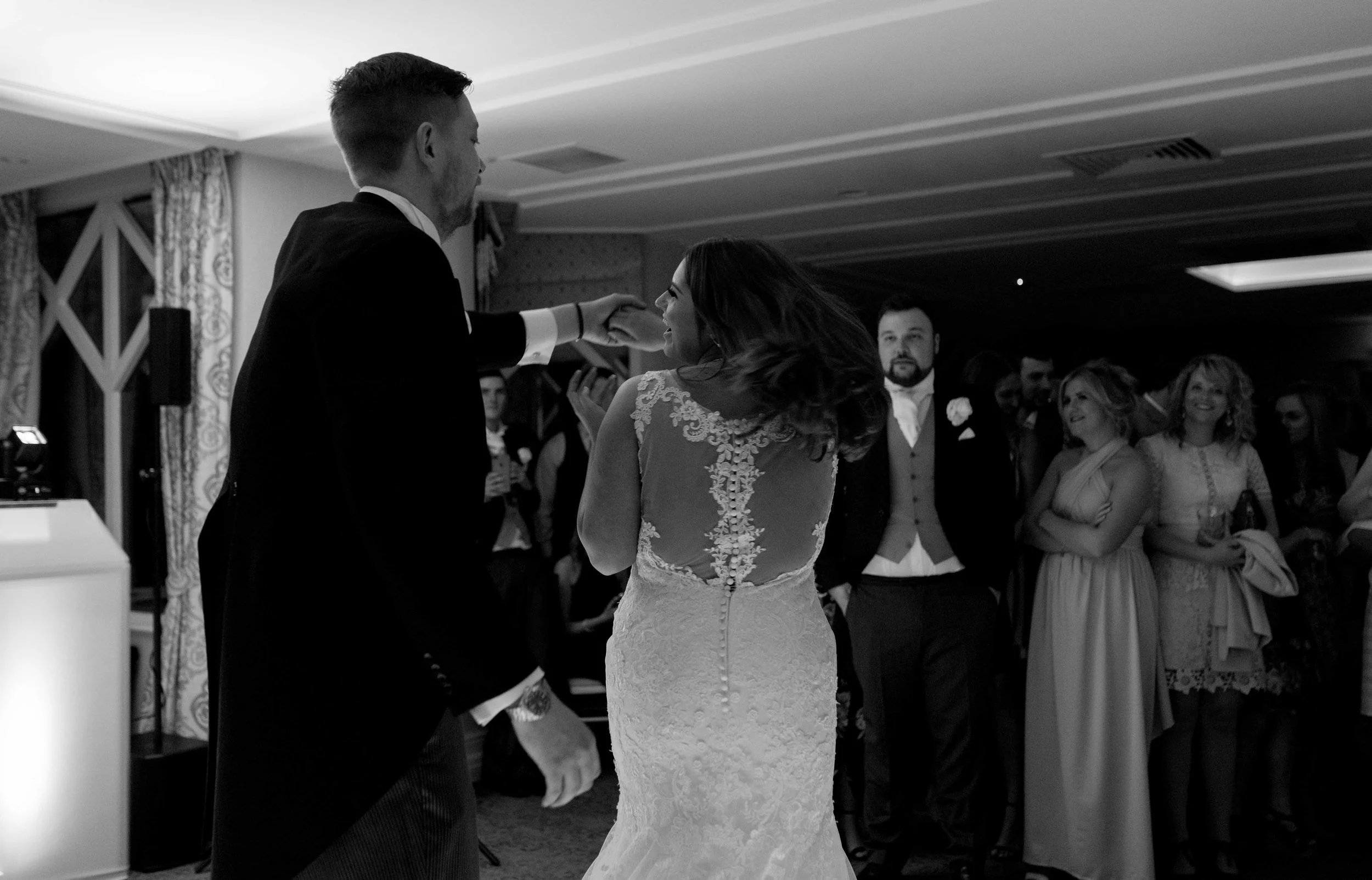 the bride and groom have their really smiley first dance