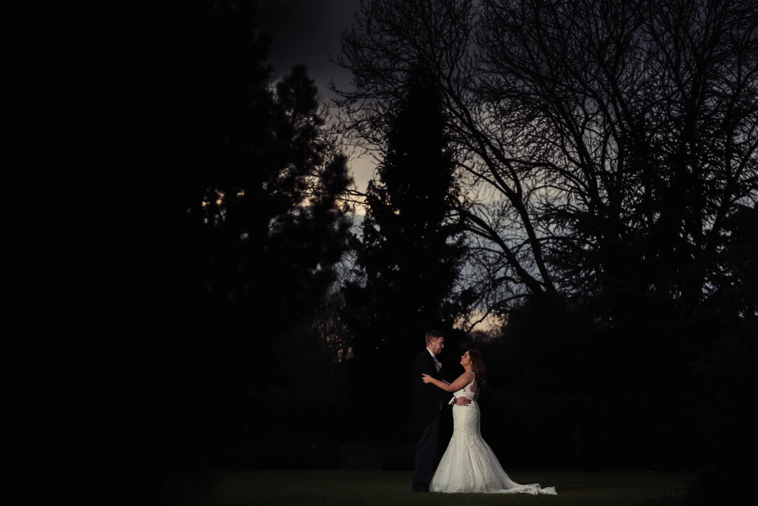the bride and groom pose for their lake district wedding photography
