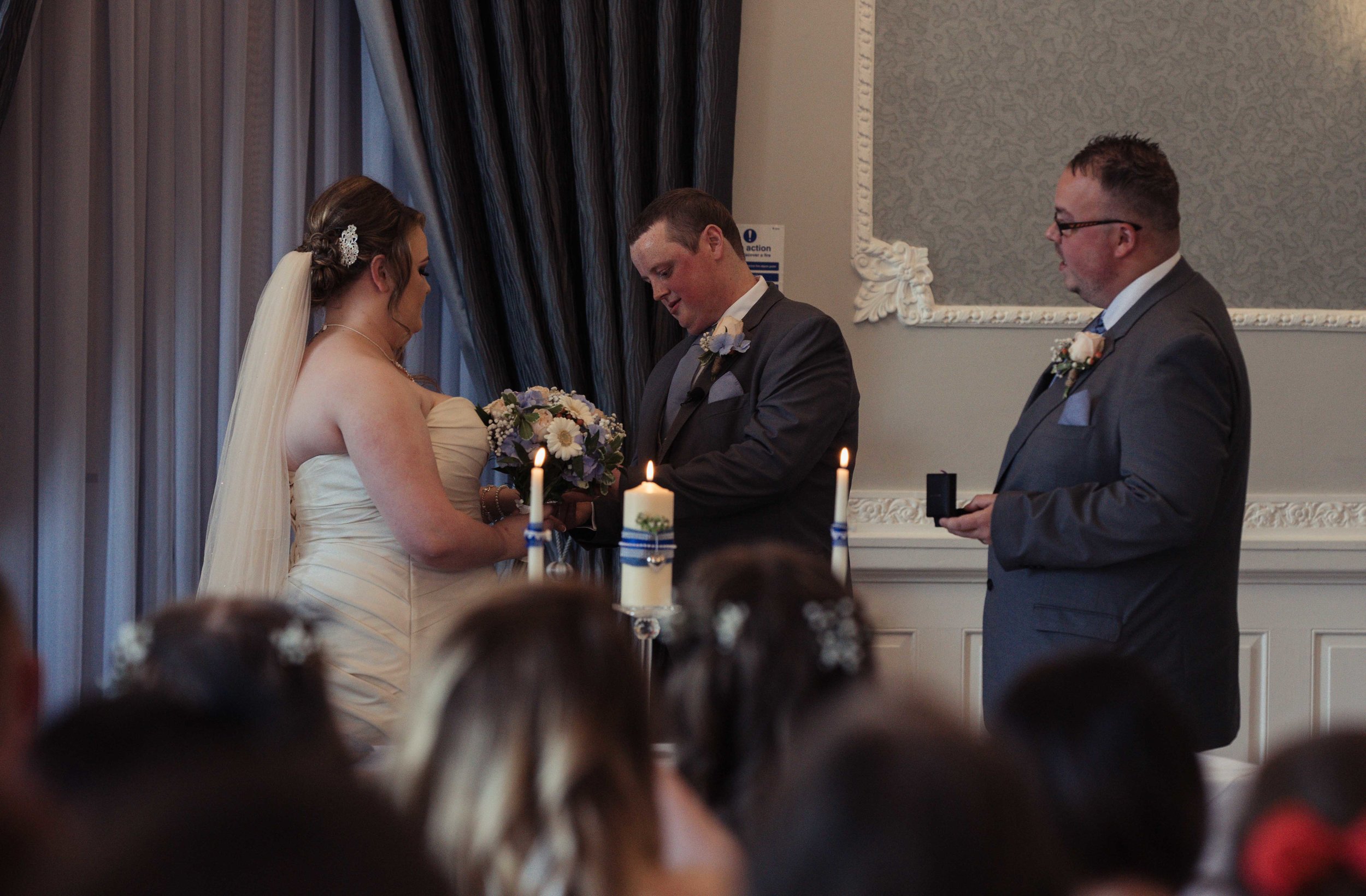 The bride and groom exchange their rings during the wedding ceremony