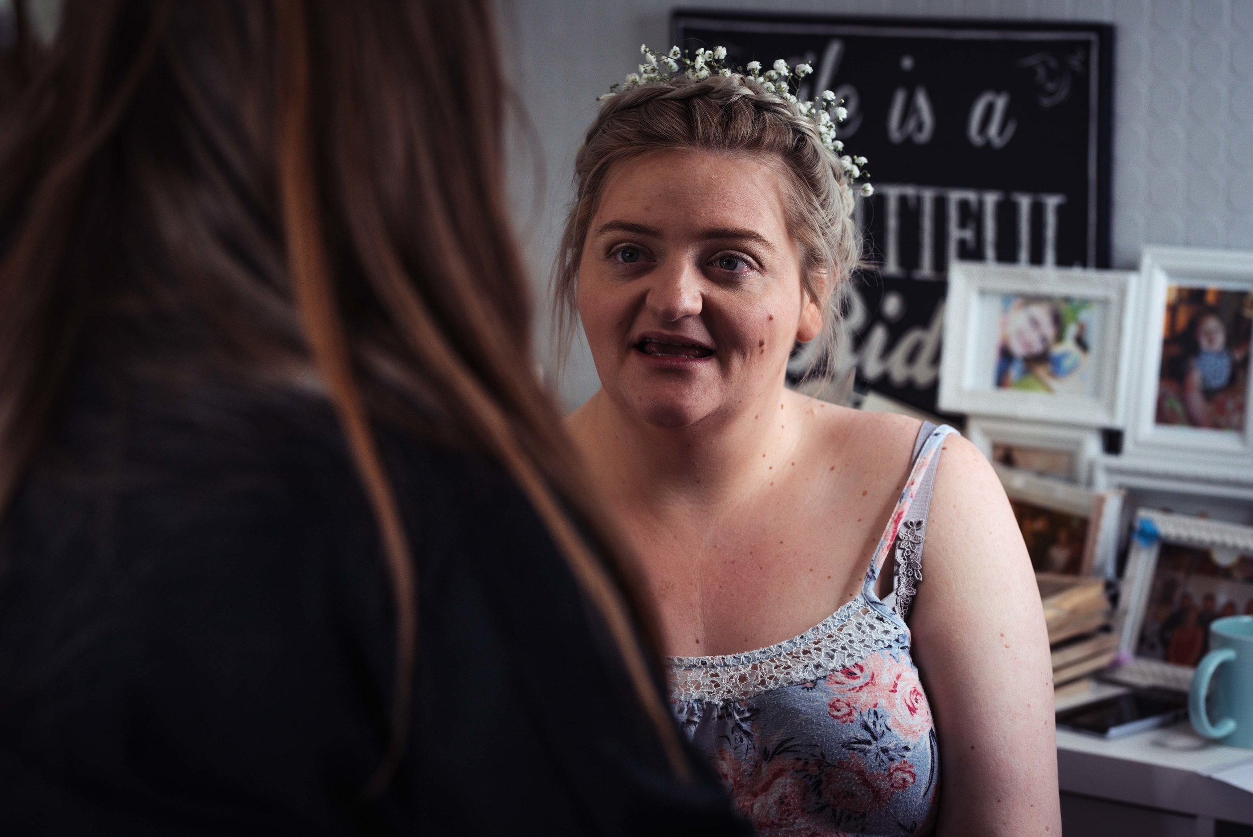 Bride having her makeup done before the wedding