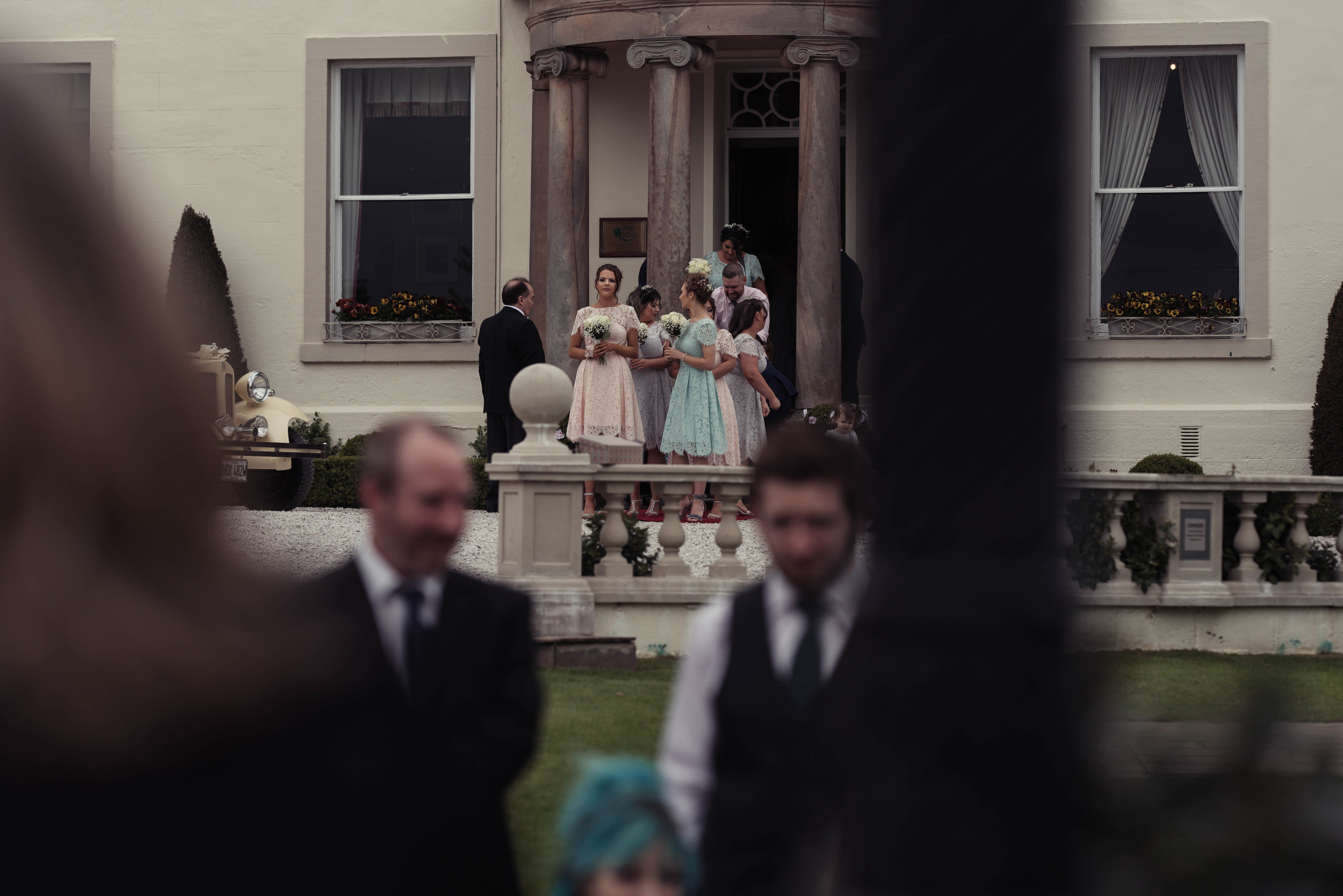 Bridesmaids gather to make their entrance to the gardens