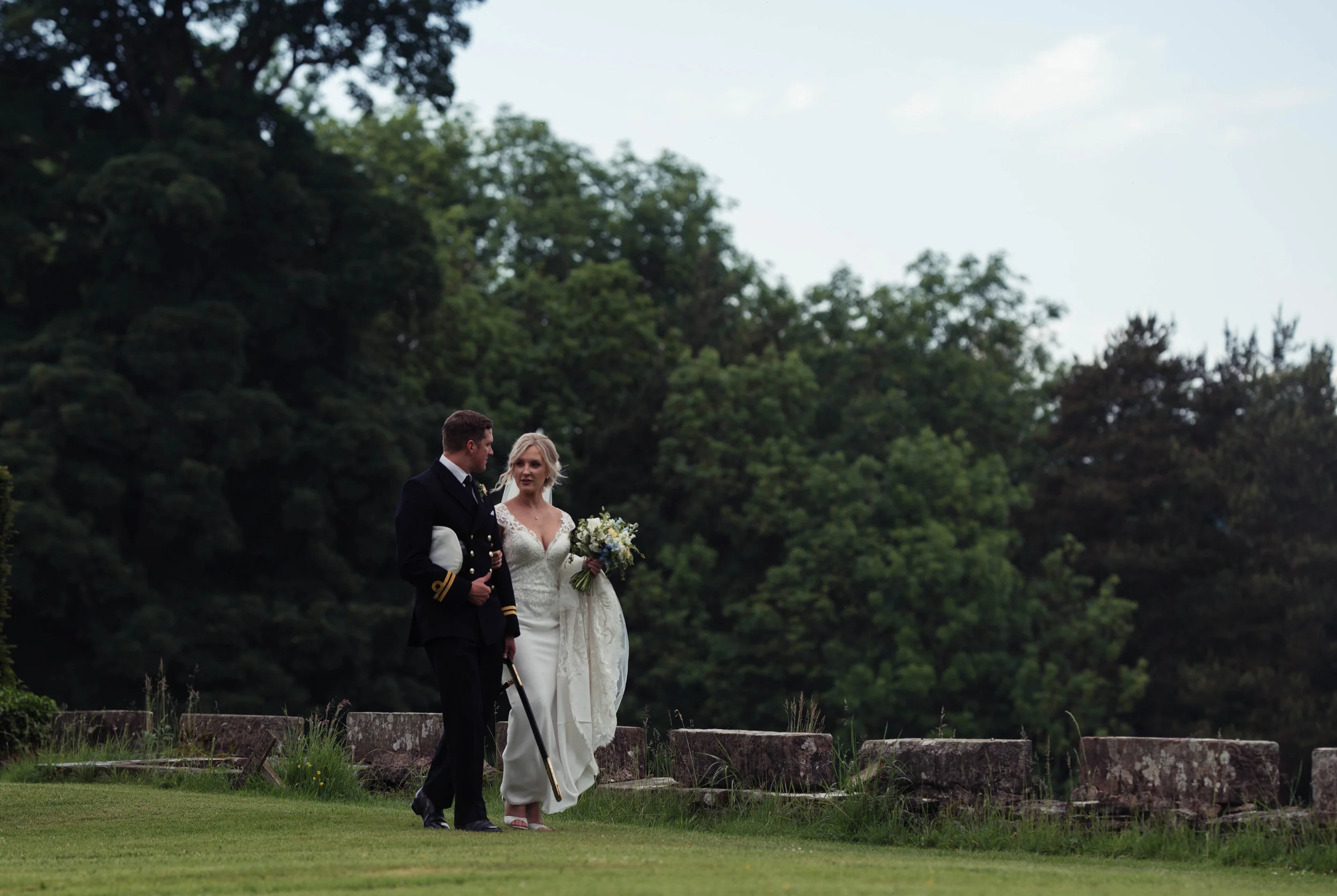 The bride and groom have a walk around the grounds at Askham Hall