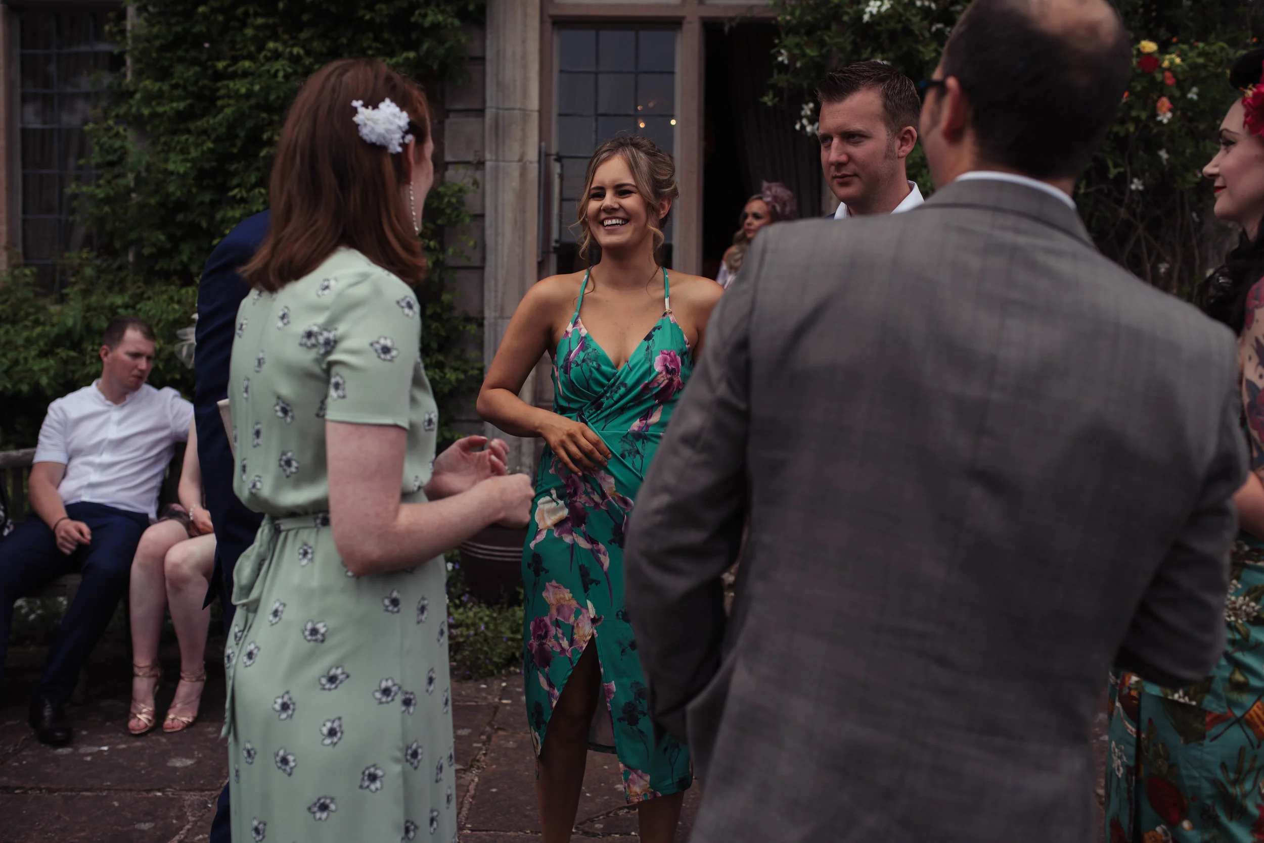 A group of guests stand outside the door of askham hall