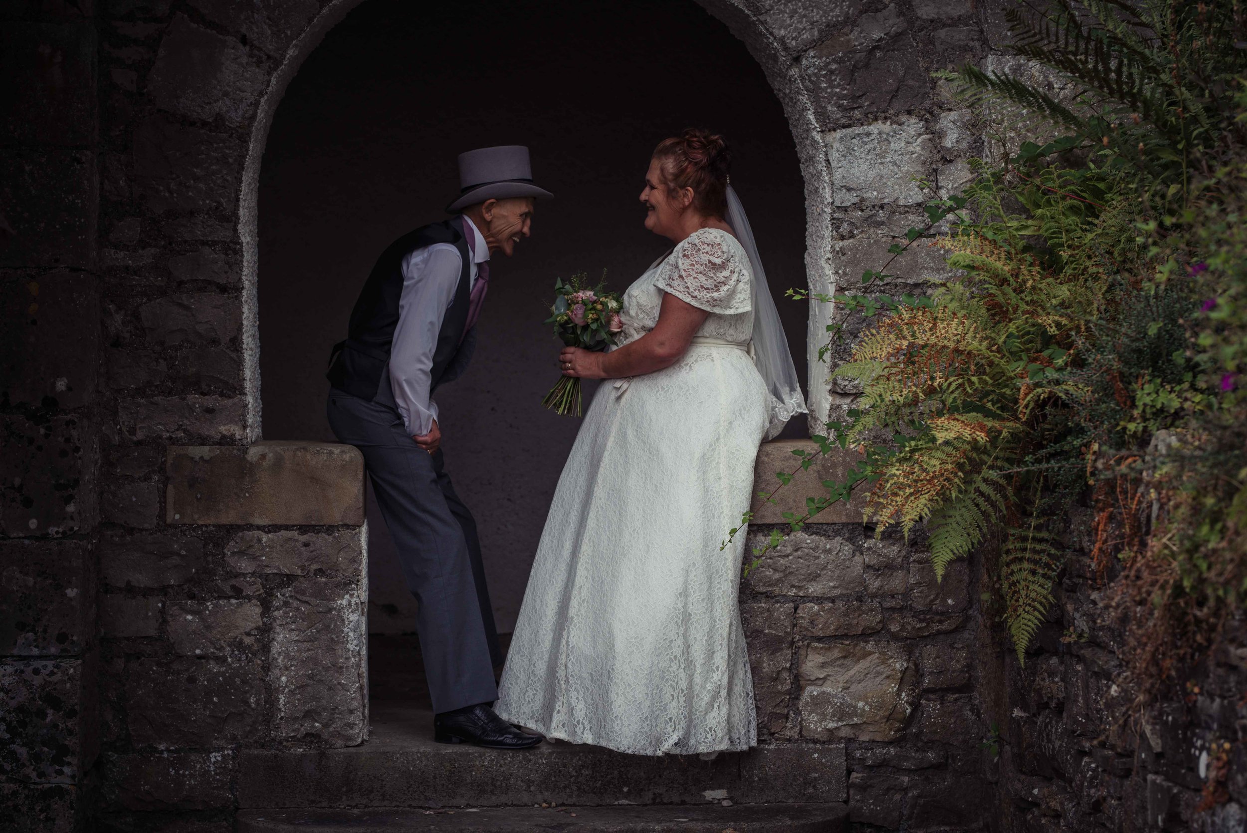 The bride and groom have an intimate moment together during their wedding photography at the castle green hotel