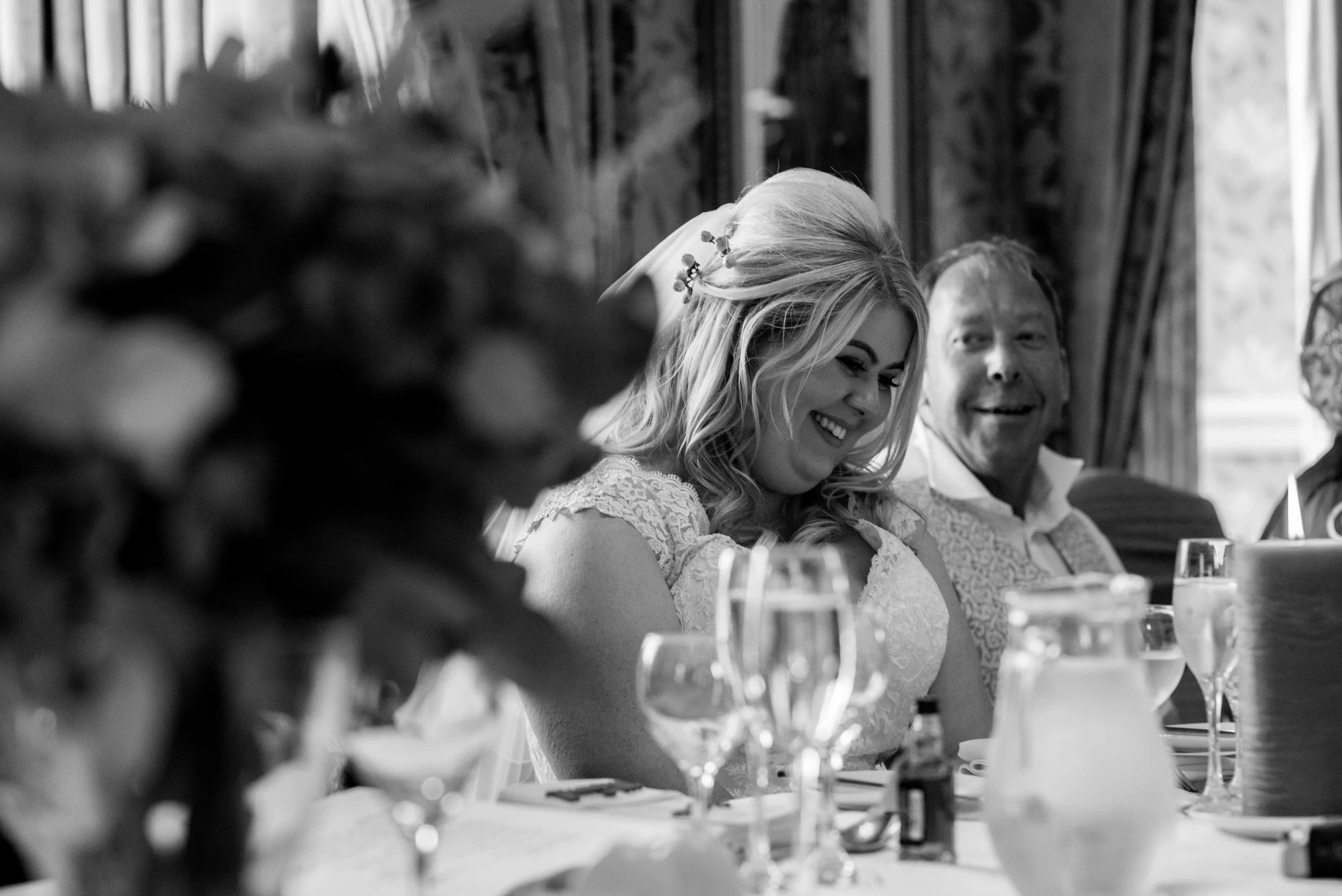 The bride has a giggle during the father of the bride speech