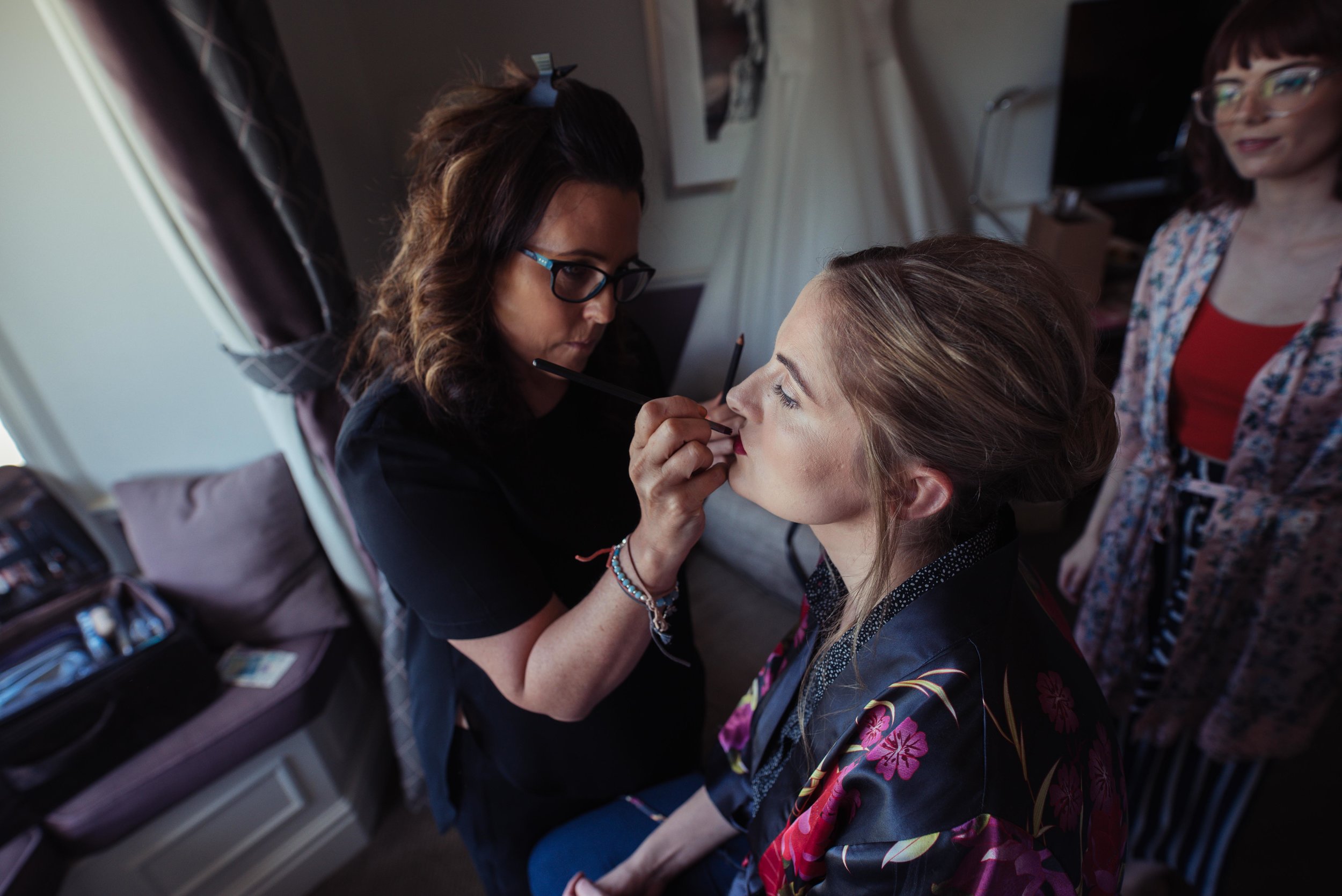 The bride having her make up done at Rookery Hall