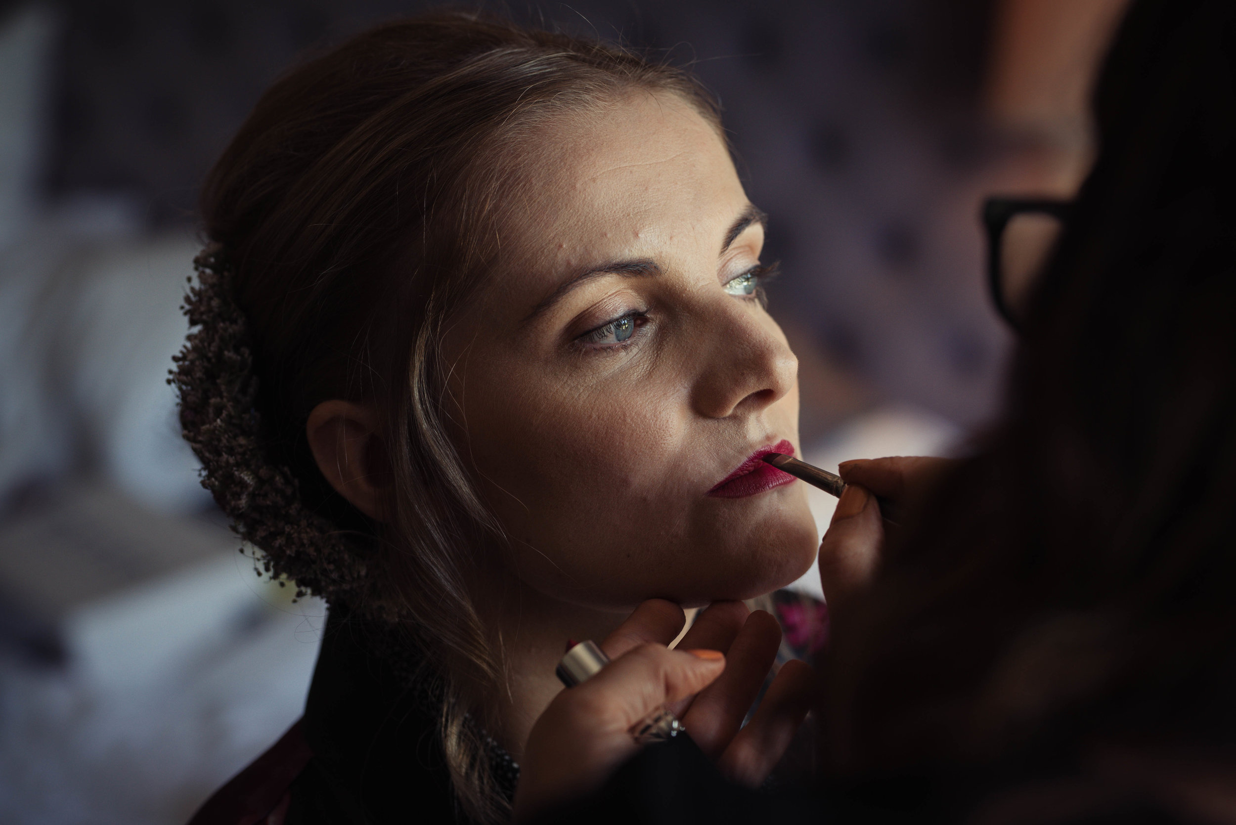 The bride having her lipstick done