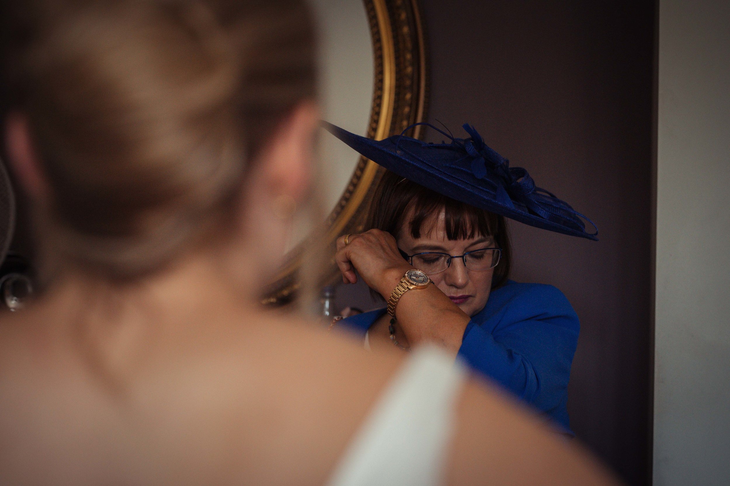 The brides mother gets emotional seeing her daughter in her wedding dress