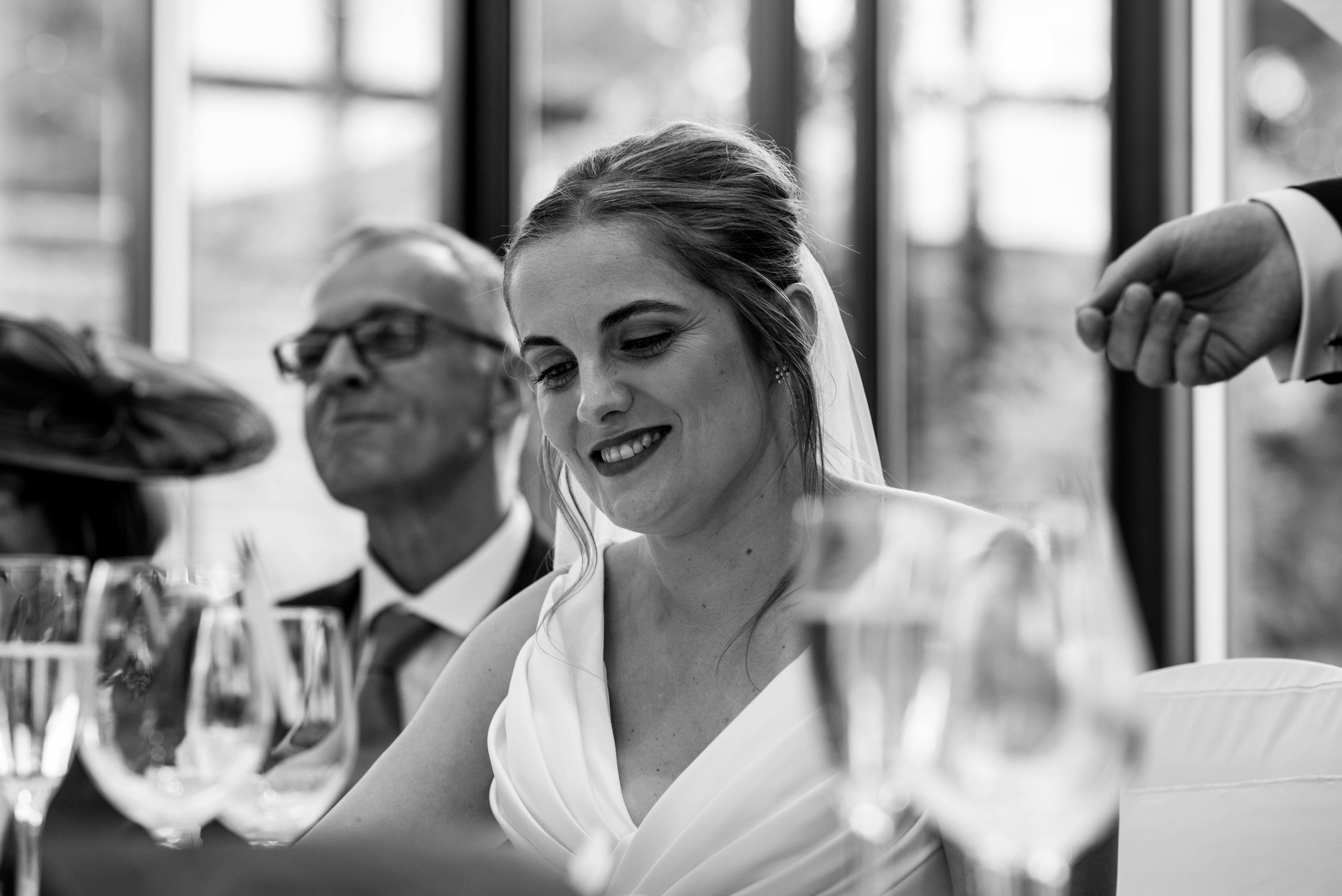 The bride during the grooms speech