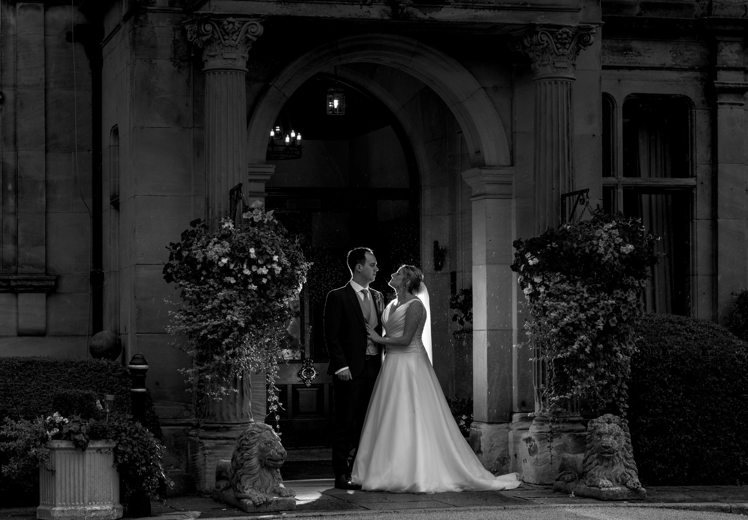 The bride and groom in the entrance to rookery hall