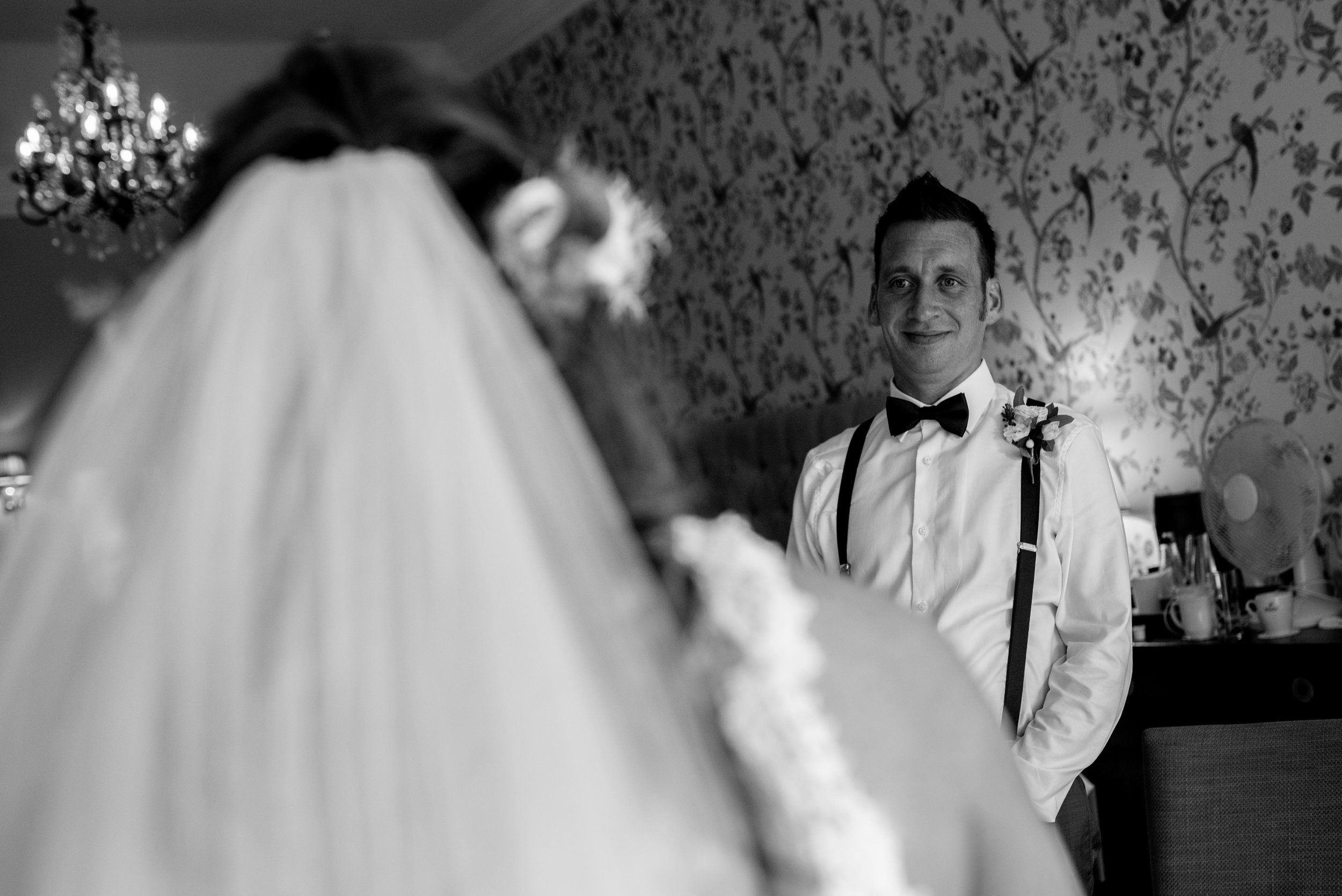 The brother of the bride sees his sister in a dress for the first time