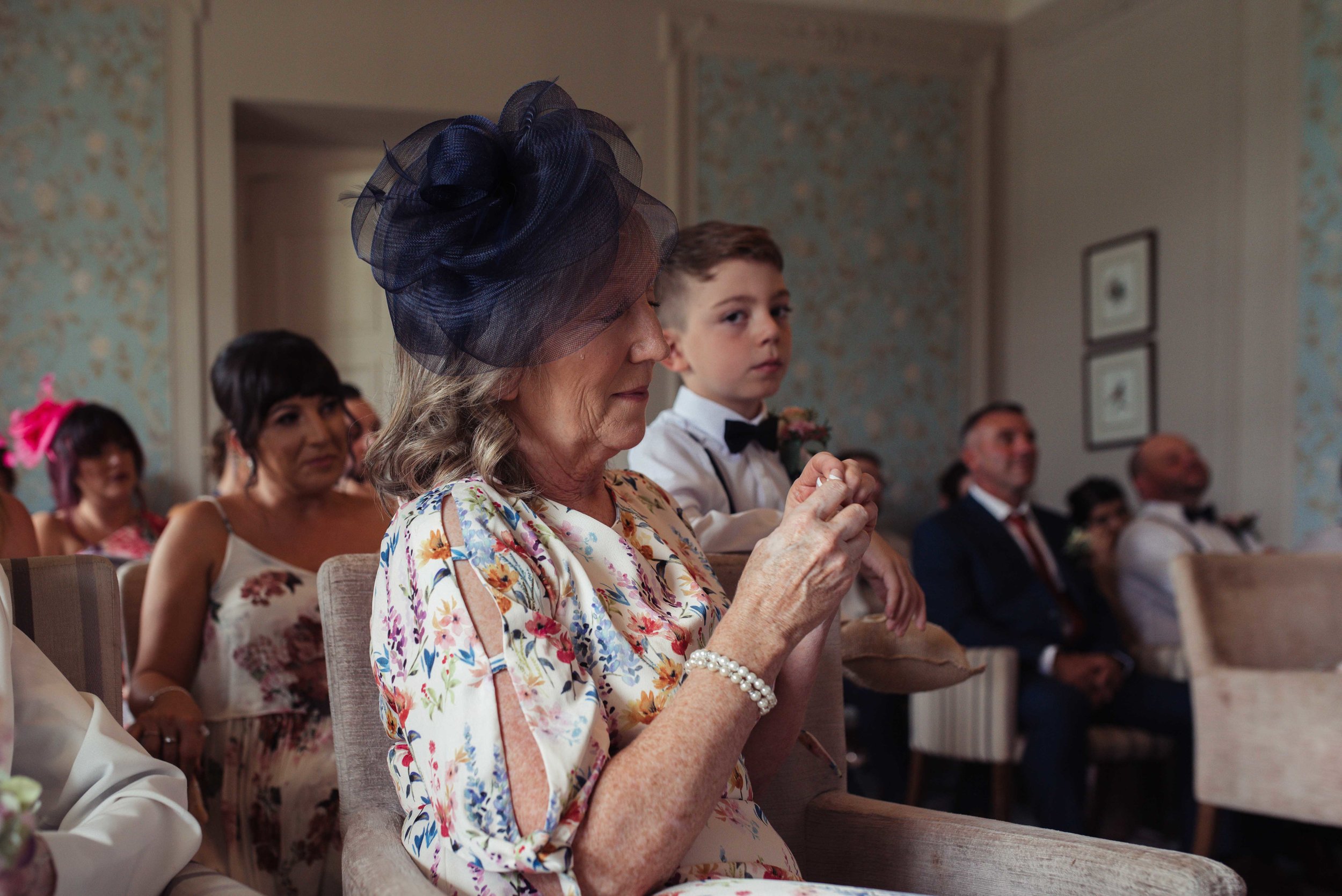 The mother of the groom in tears during the ceremony