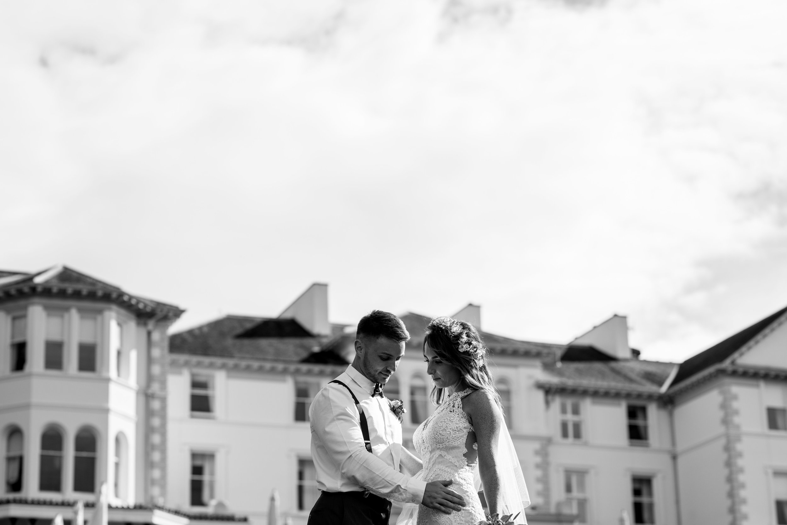 Bride and groom in black and white with the Lake District Belsfield in the background