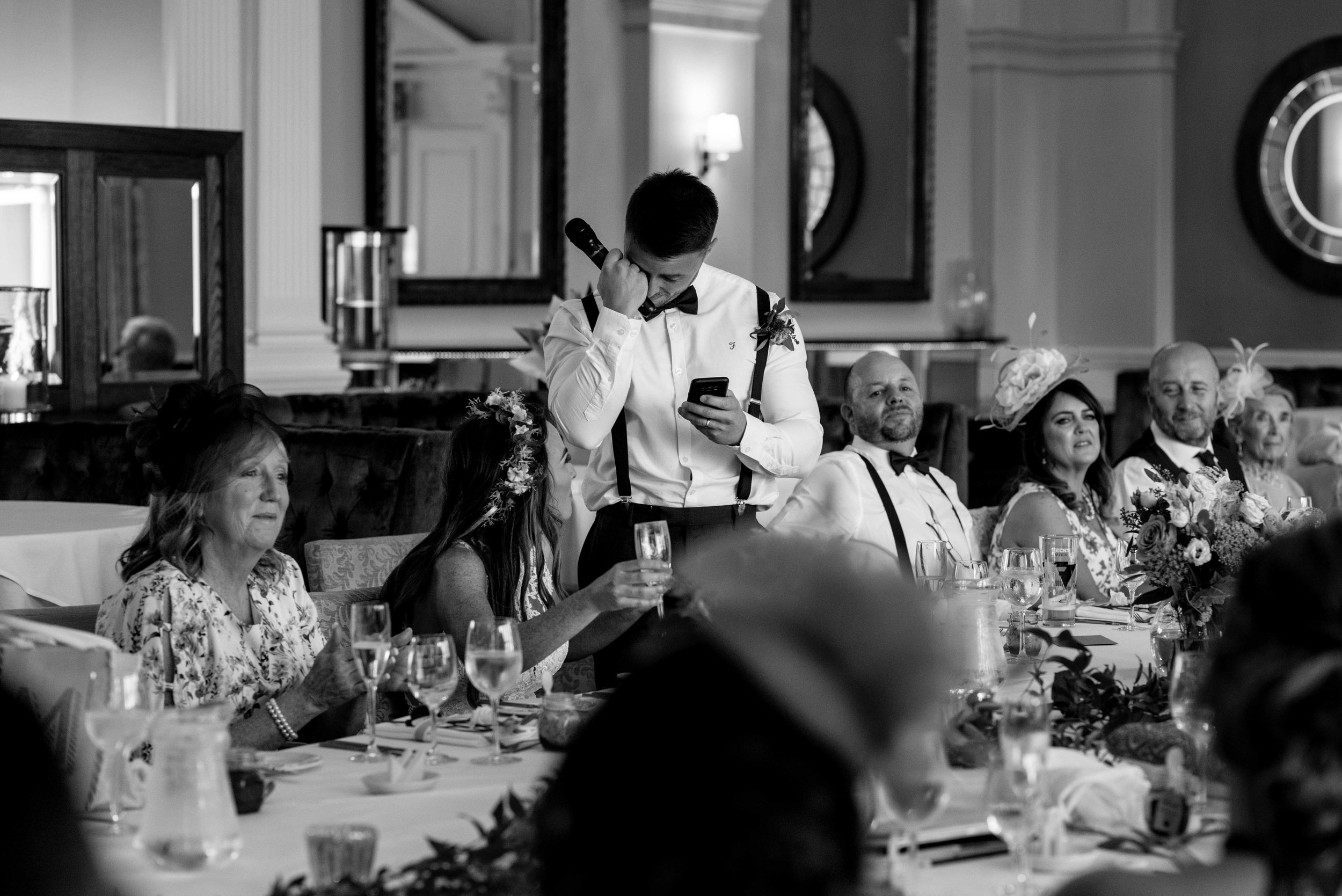 The groom wipes a tear from his eyes