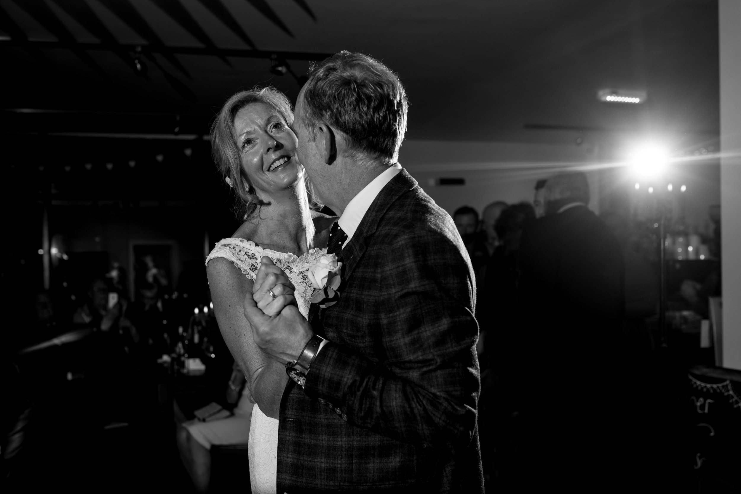 The bride looking really happy during the first dance