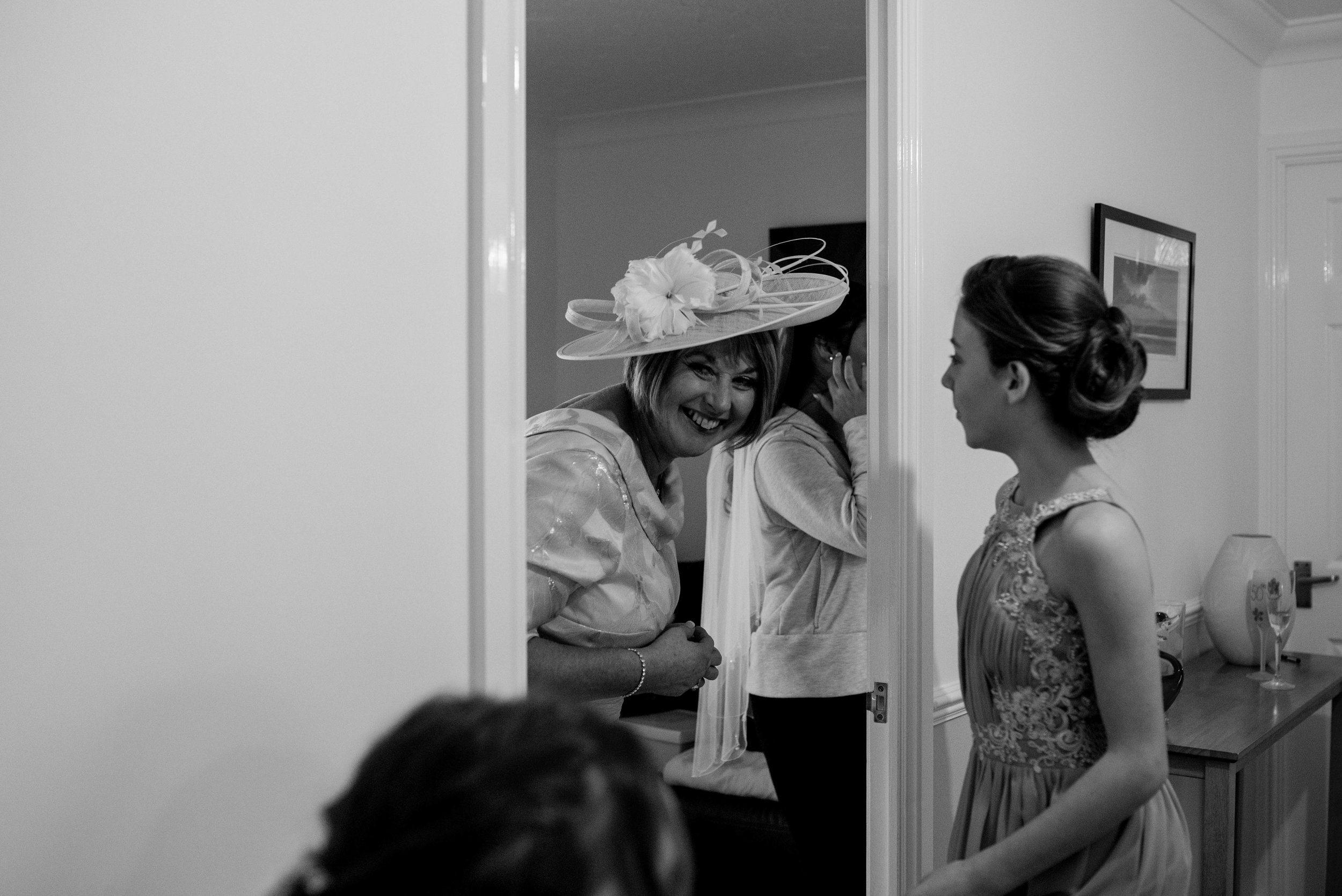 The brides mother peeps around the corner