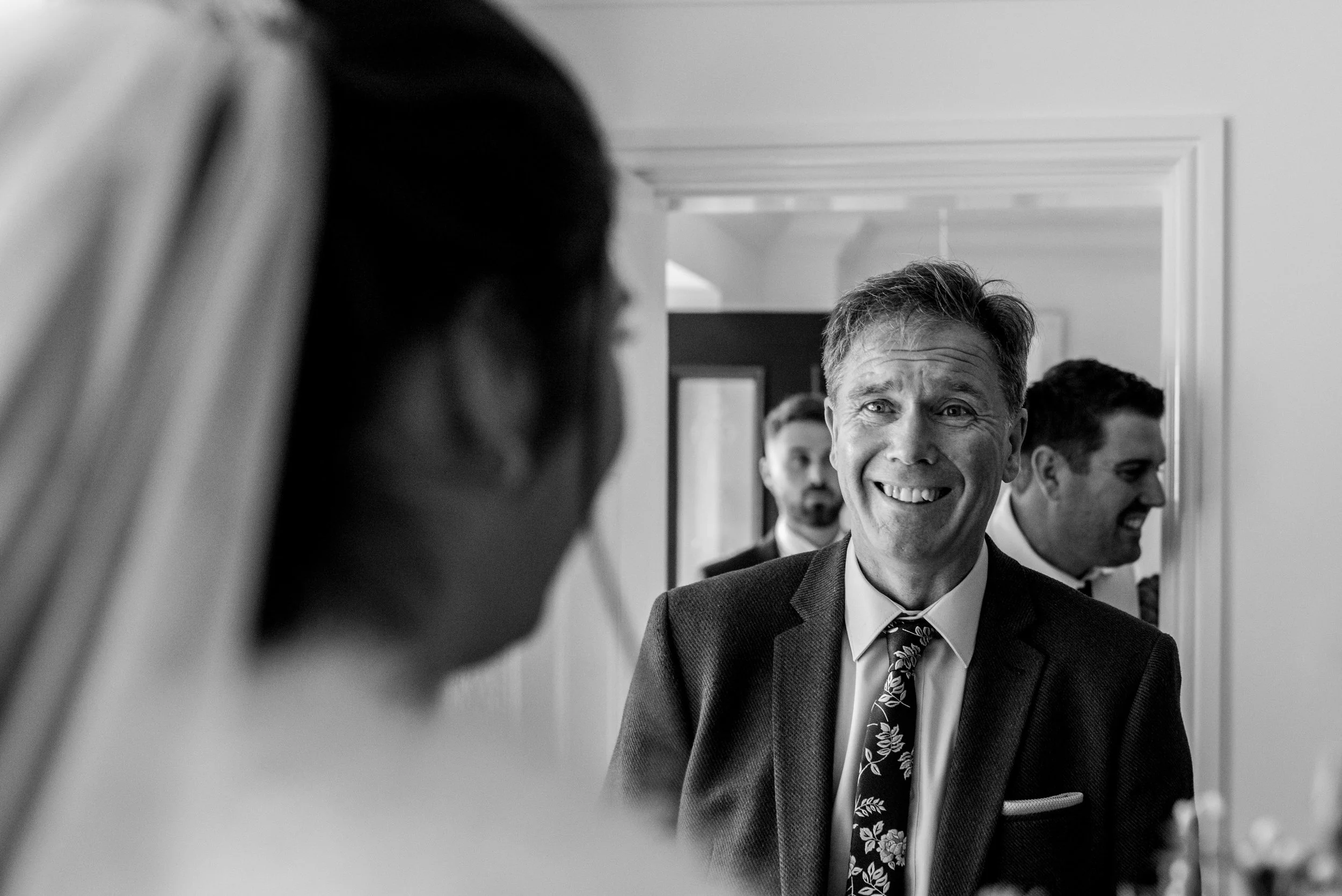 Father of the bride sees his daughter in a dress for the first time