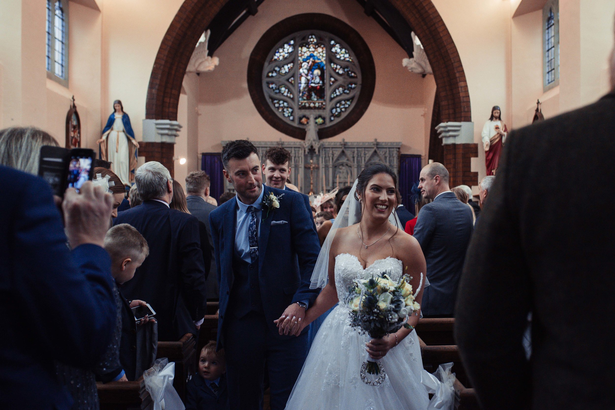 The bride and groom exit down the aisle