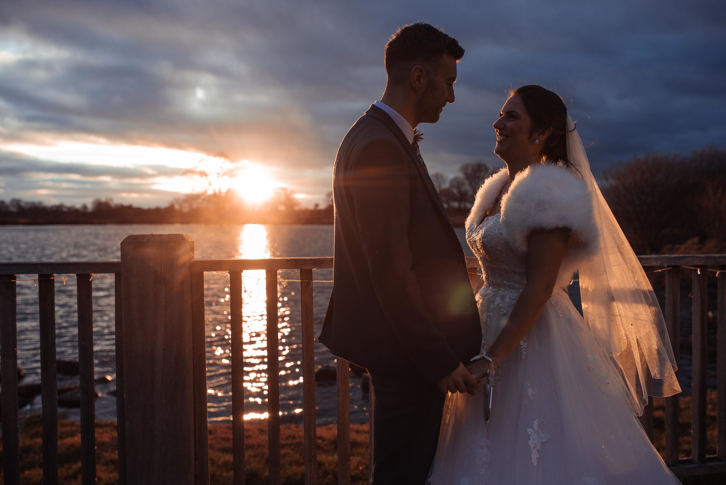 Sunset with a bride and groom at sandhole oak barn