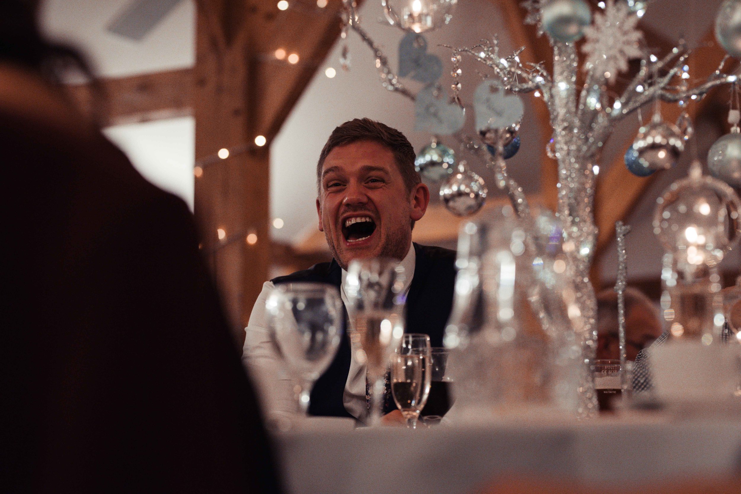 man laughs during the speeches