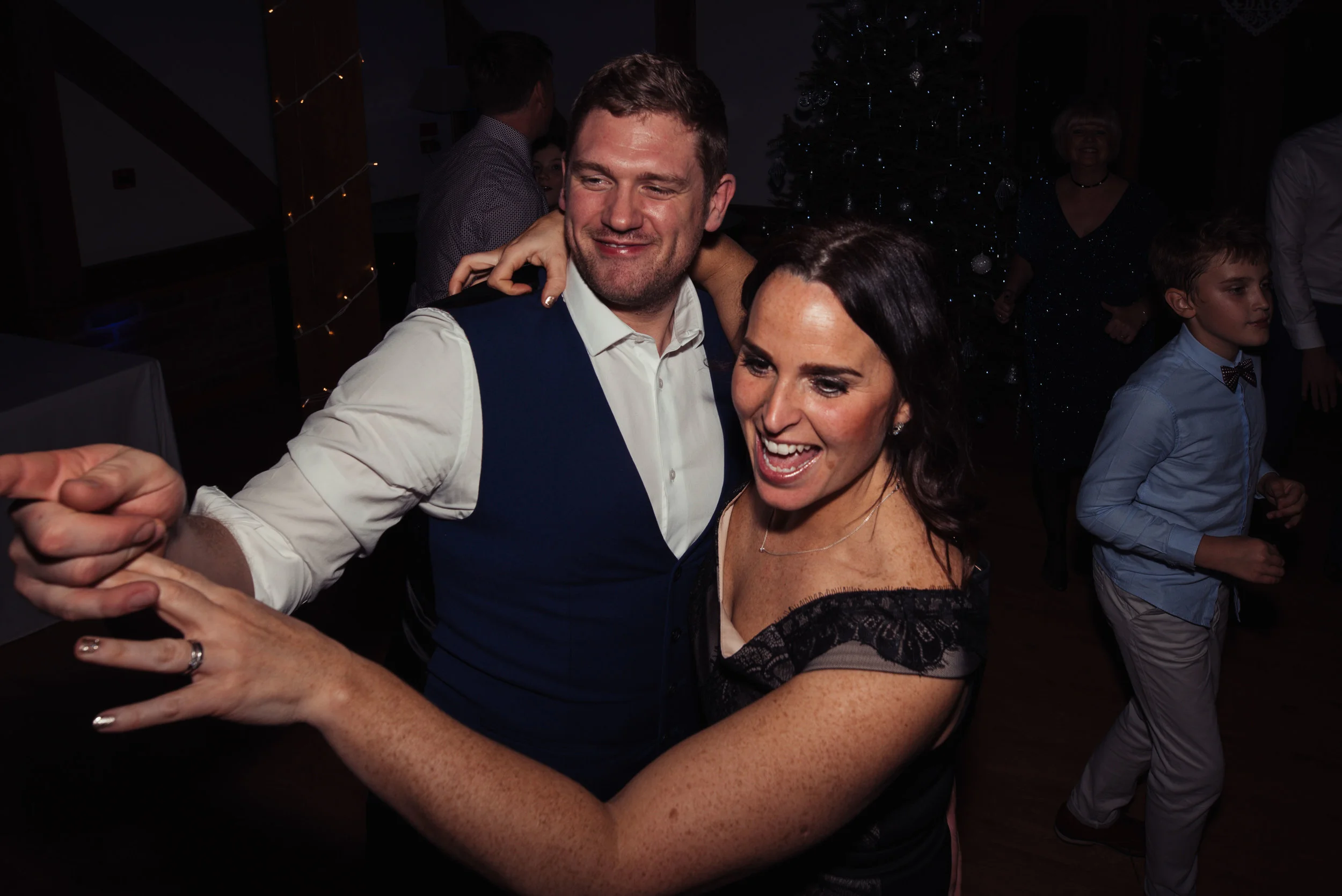 Two wedding guests dancing