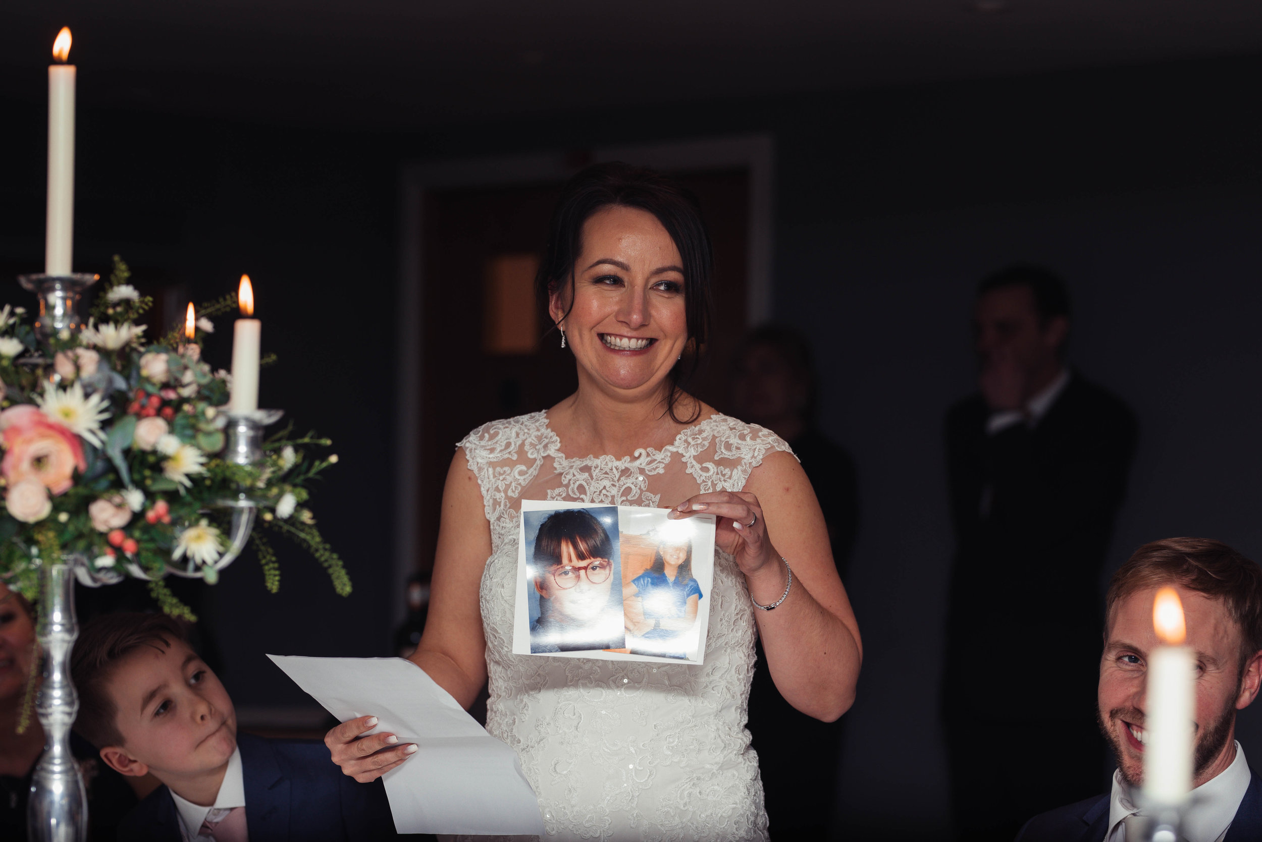 The bride stands to deliver her speech