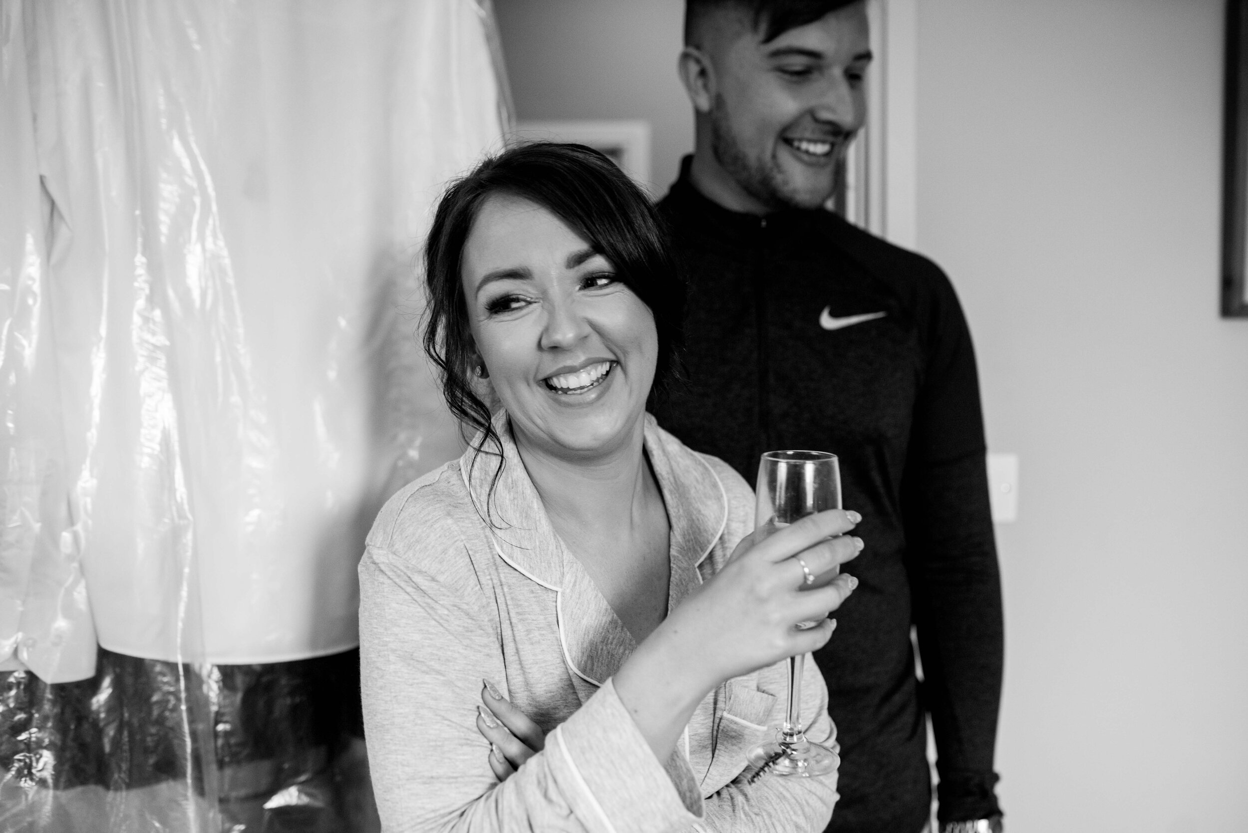 Bridesmaid holding a glass of prosecco