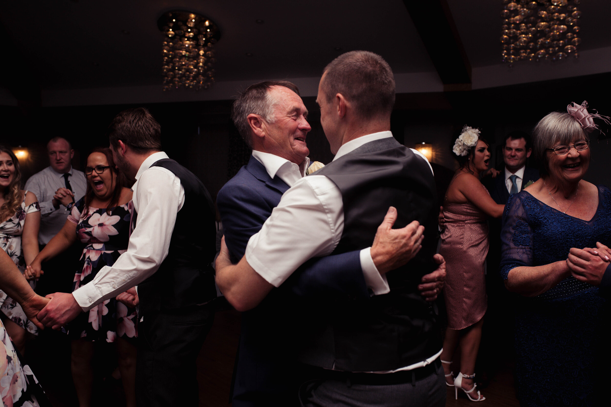 Father and son dance on the dance floor