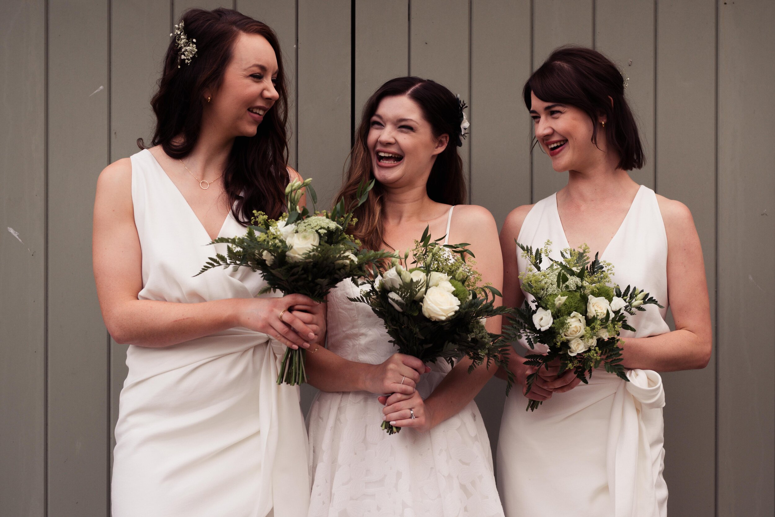 Bridesmaids laugh together