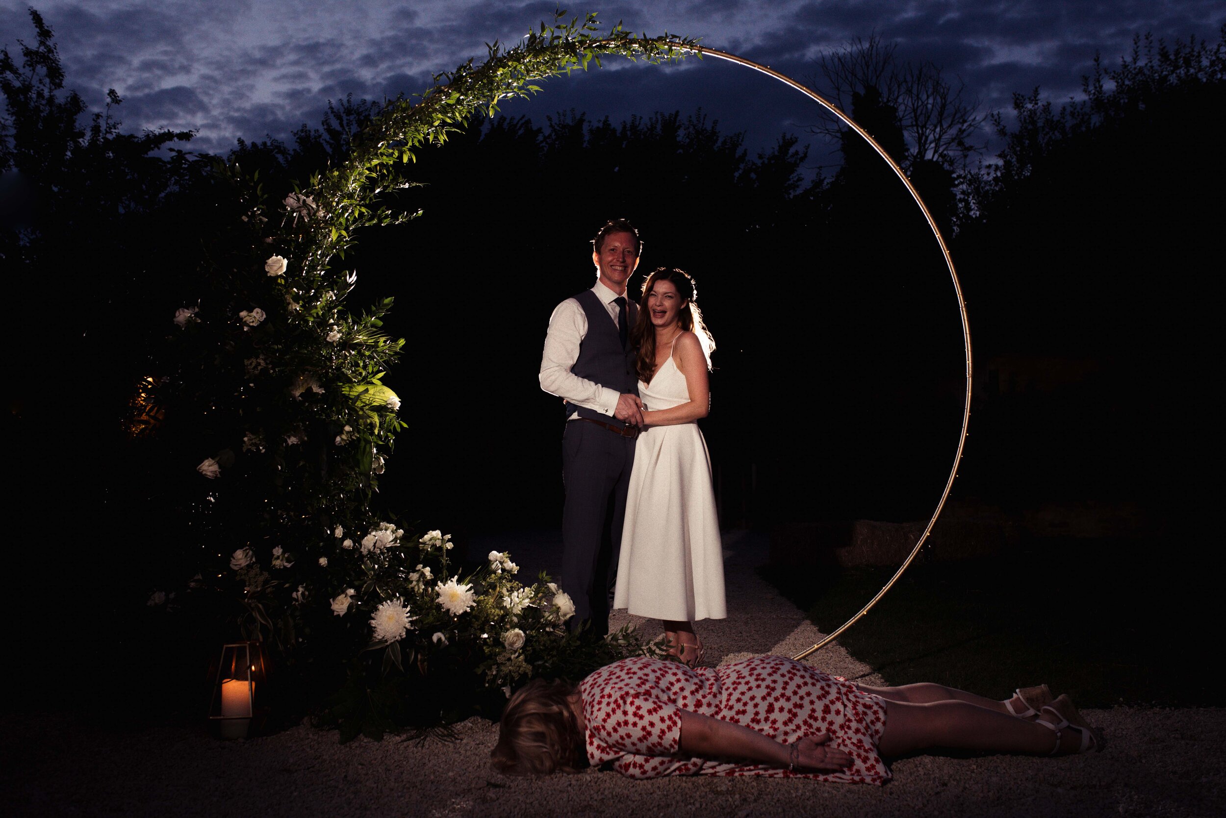 Wedding guest lies in the middle of a night portrait