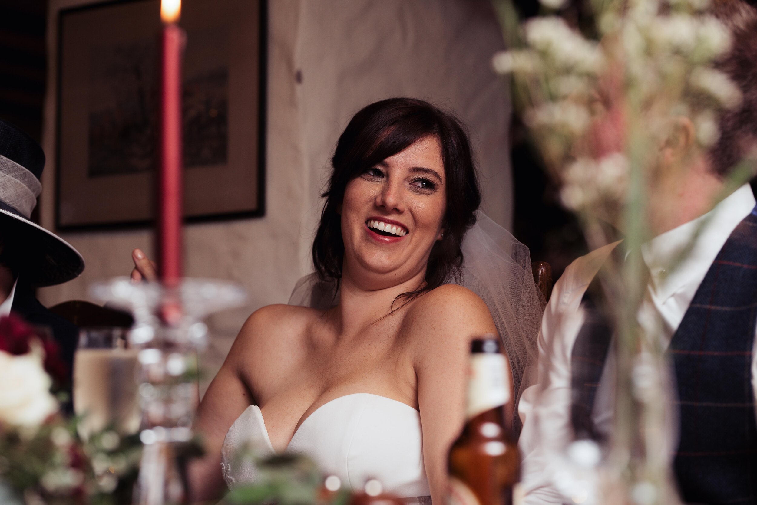 Bride laughing at her dads speech