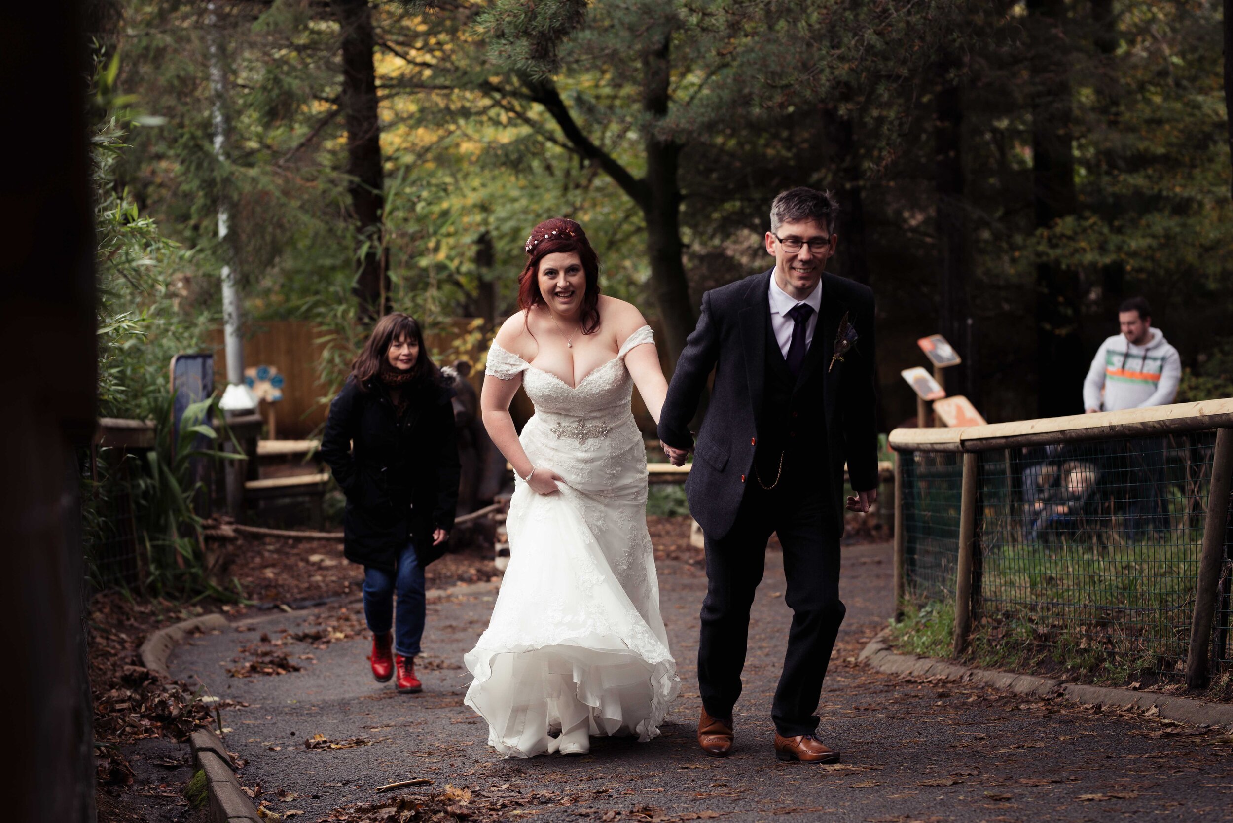 bride and groom walking with visitors to Edinburgh Zoo