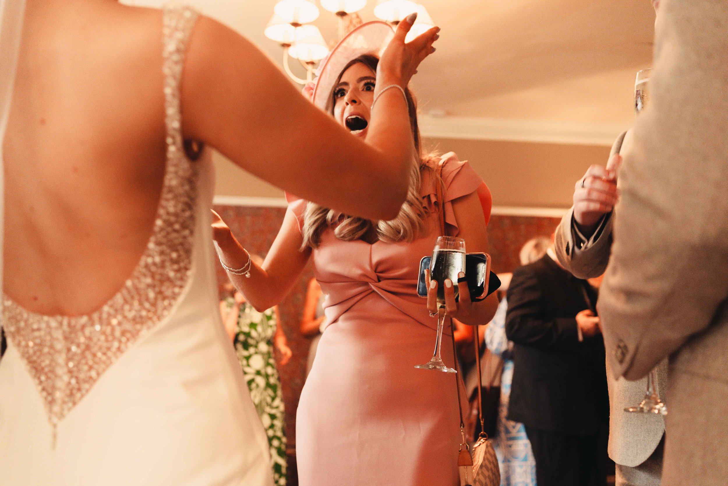 Wedding guest excited to hug the bride