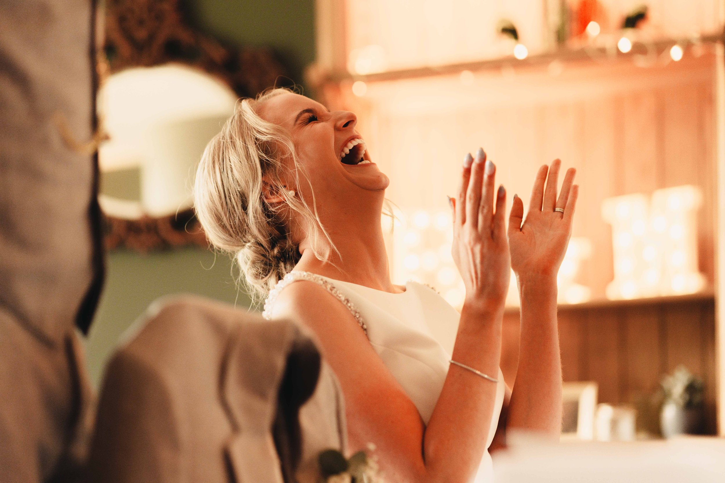 Bride howls laughing during the speeches