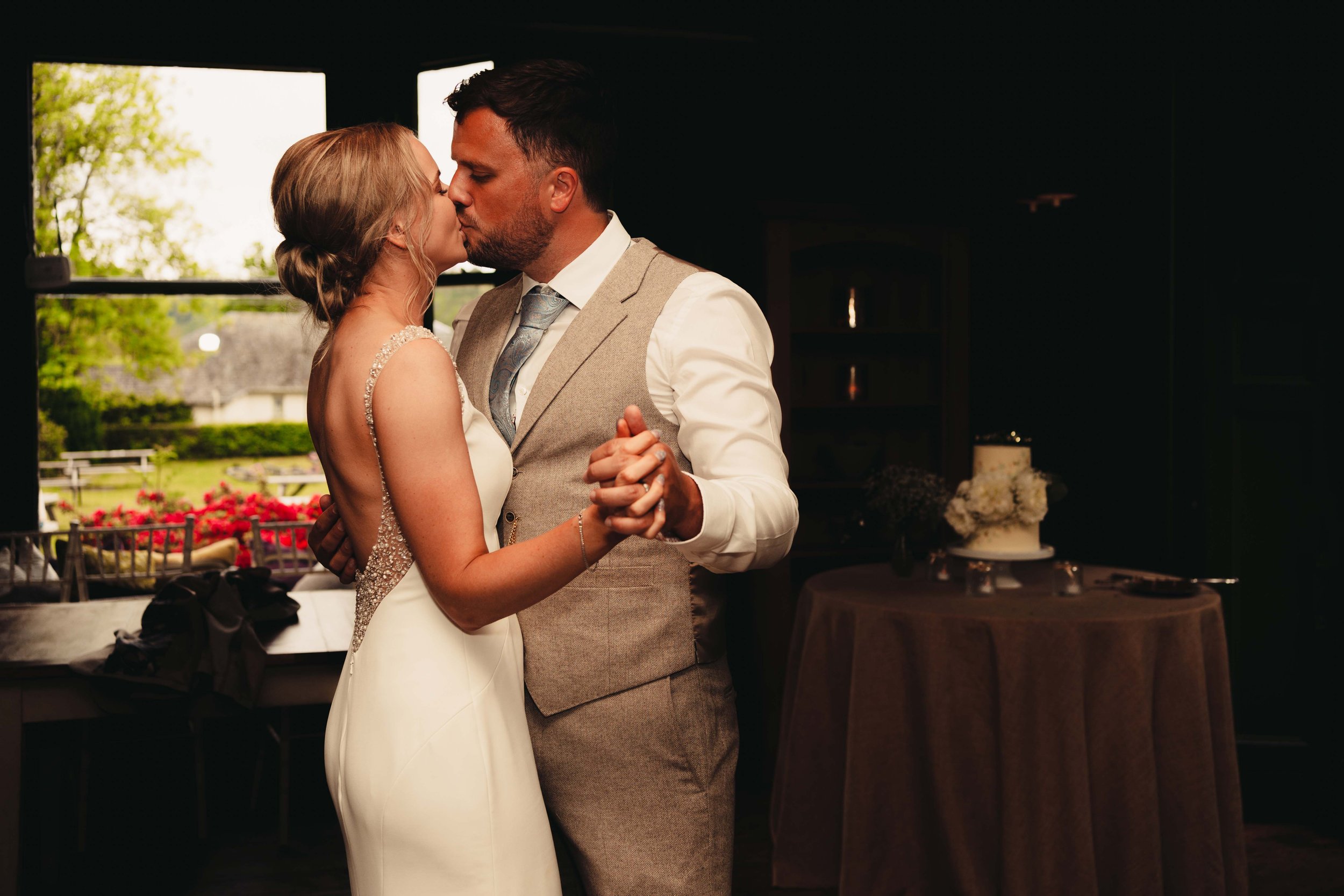 Bride and groom kiss during first dance