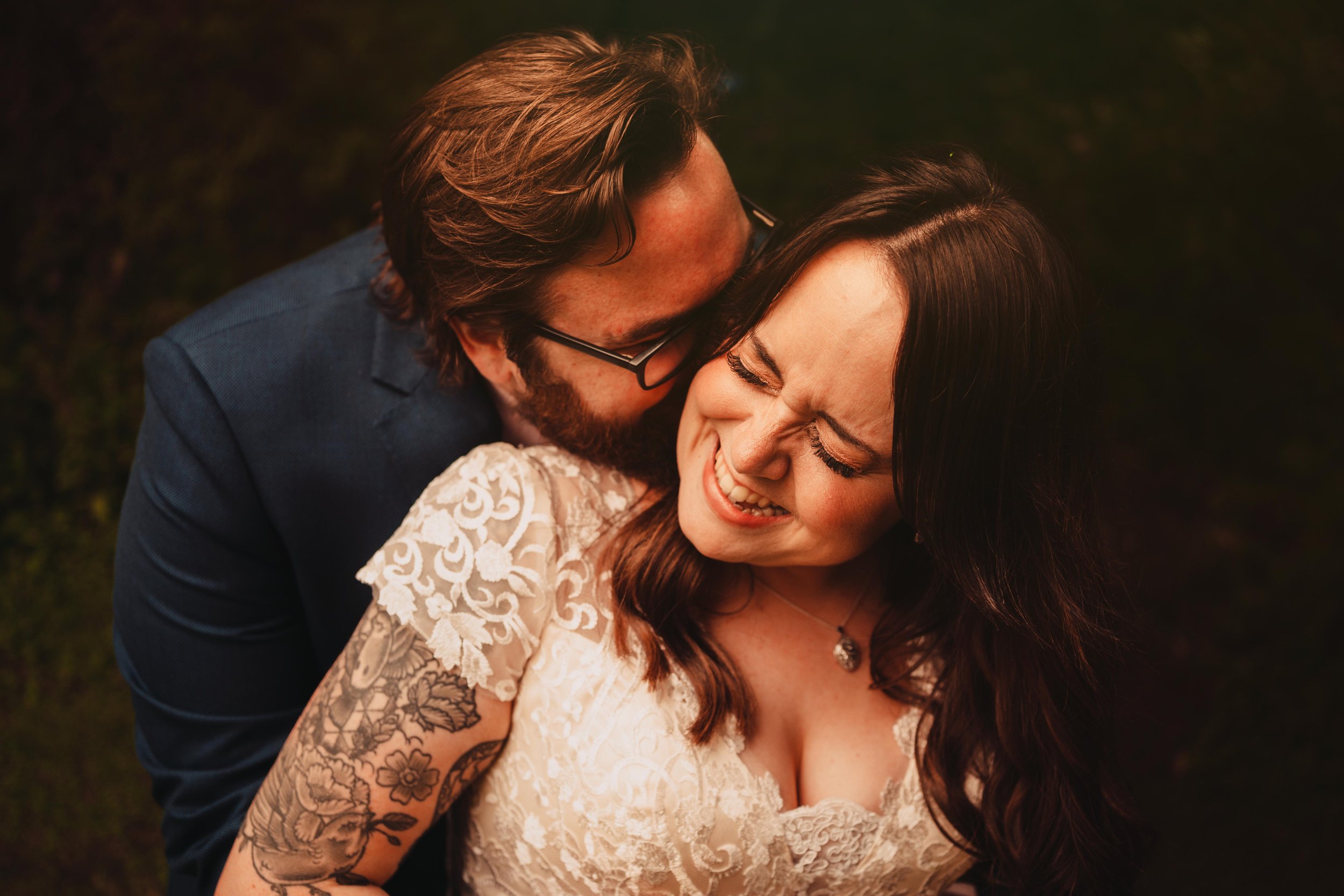 Tattooed bride and groom in the lake district