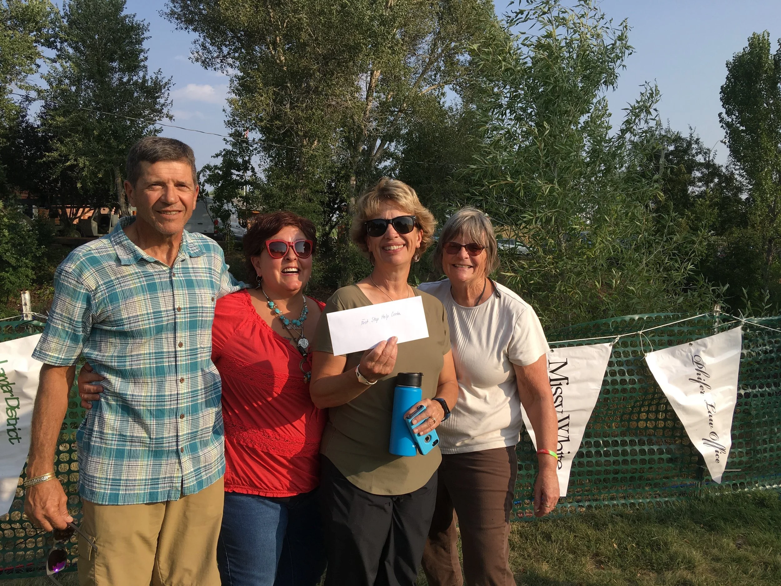 Paul Cornia, Tammy Green, Kristy Jones and Linda Hudson accept the check.