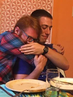 Ben and Gavin saying goodbye at 2017's Godspeed Nosh. Photo by Alice Connor.
