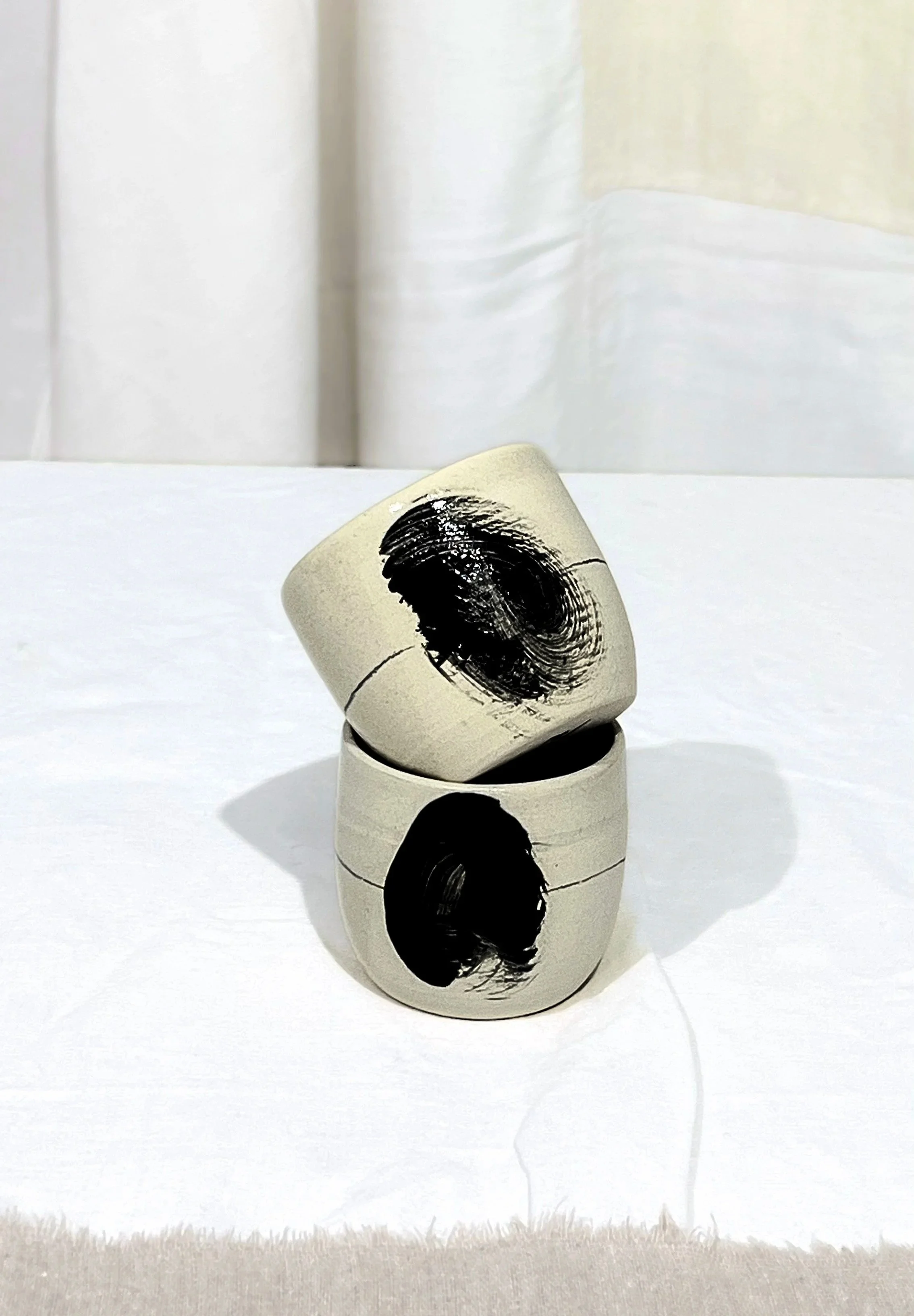 Pair of stoneware handmade cups. Brush stroke.