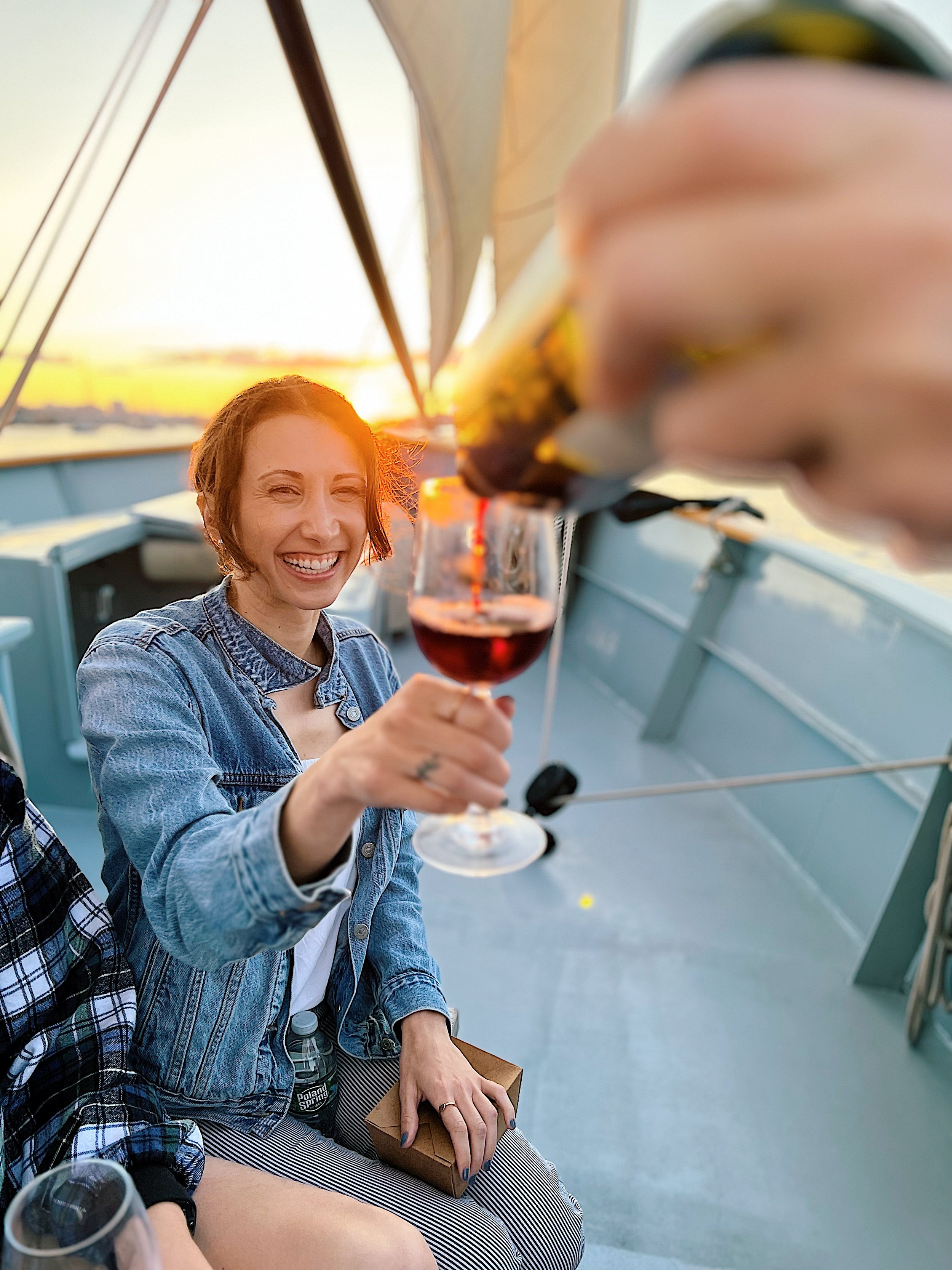 wine_wise_sail_Portland_Maine_women_winemaker_sunset_people_smile_pour_red.jpg