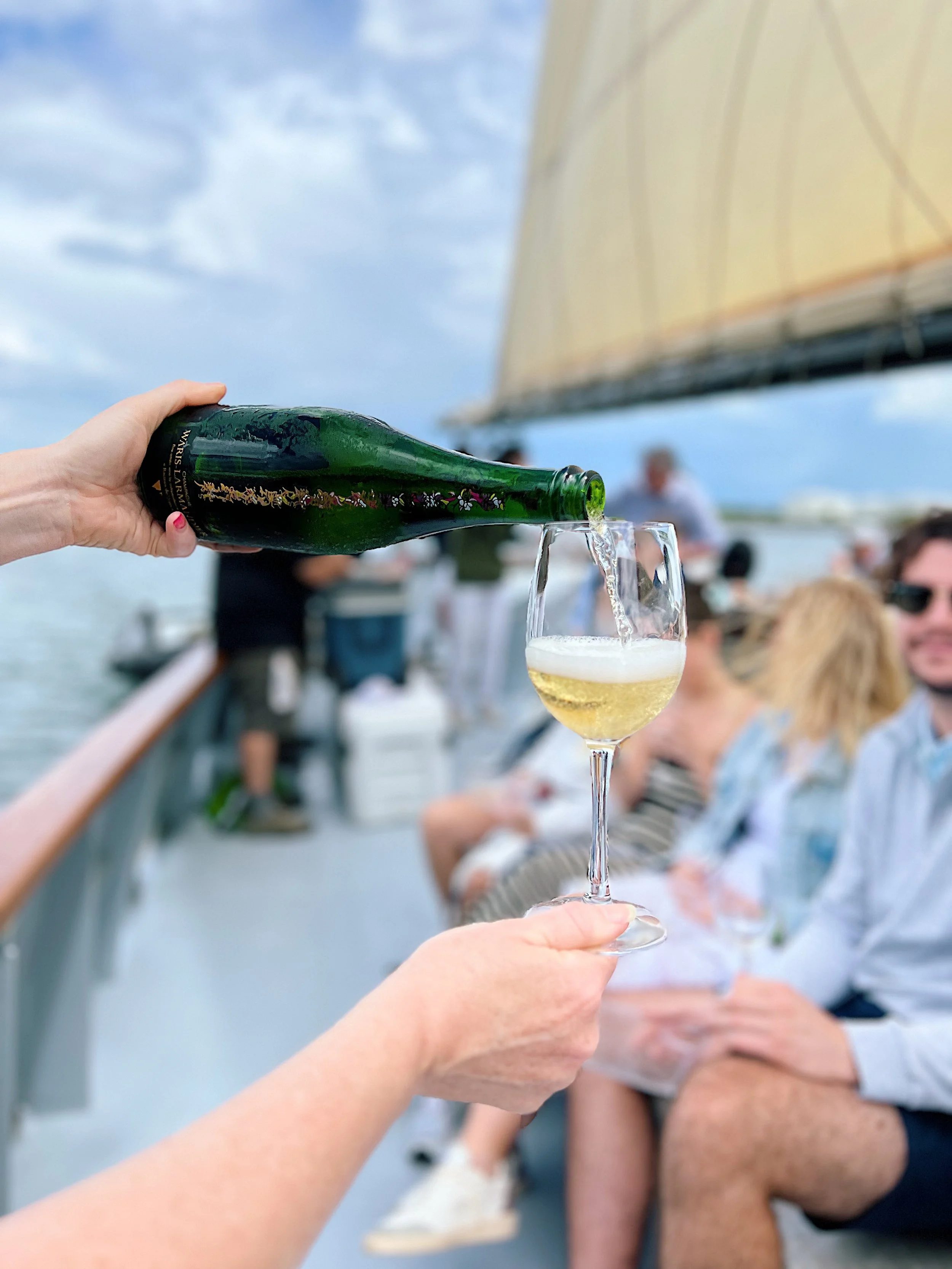 wine_wise_events_portland_maine_sparkling_sail_pour_champagne_bright.JPEG