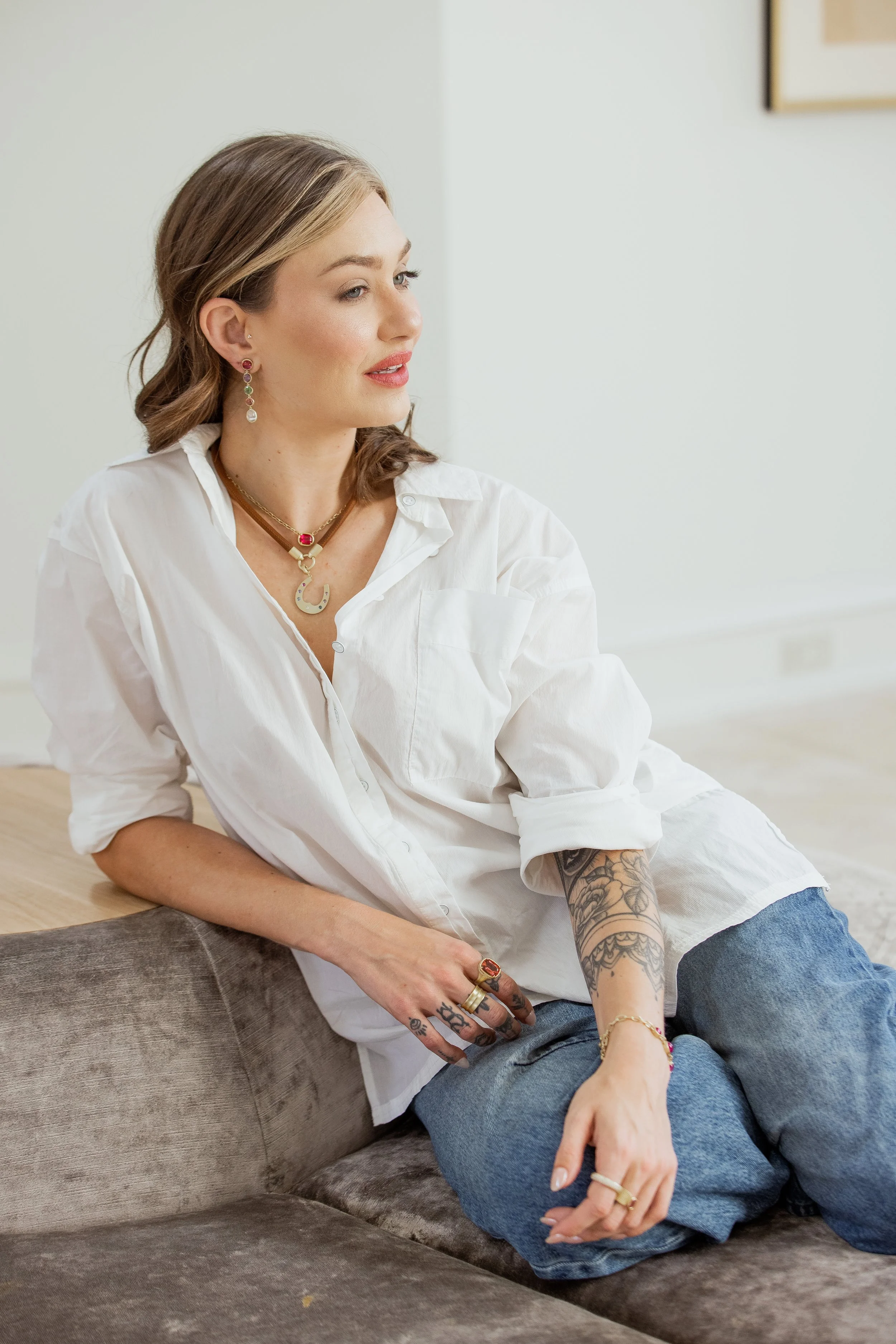 model wearing Leigh Maxwell Cabochon Horseshoe Pendant - Sapphire