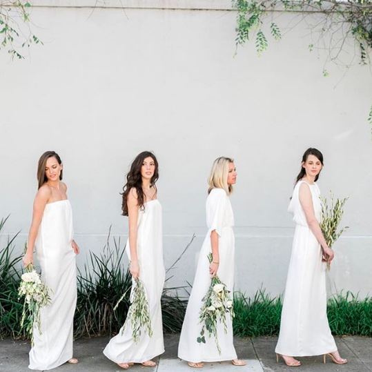 An all-white bridal party enhances the minimalist look.