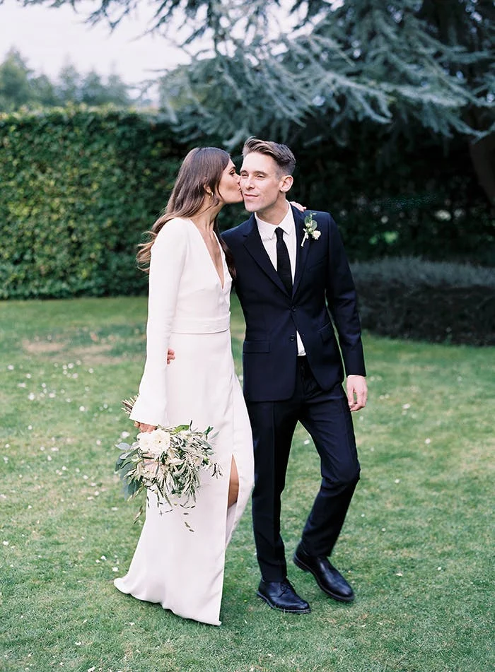 This minimalist bride and groom opt for modern attire for their nuptials. 