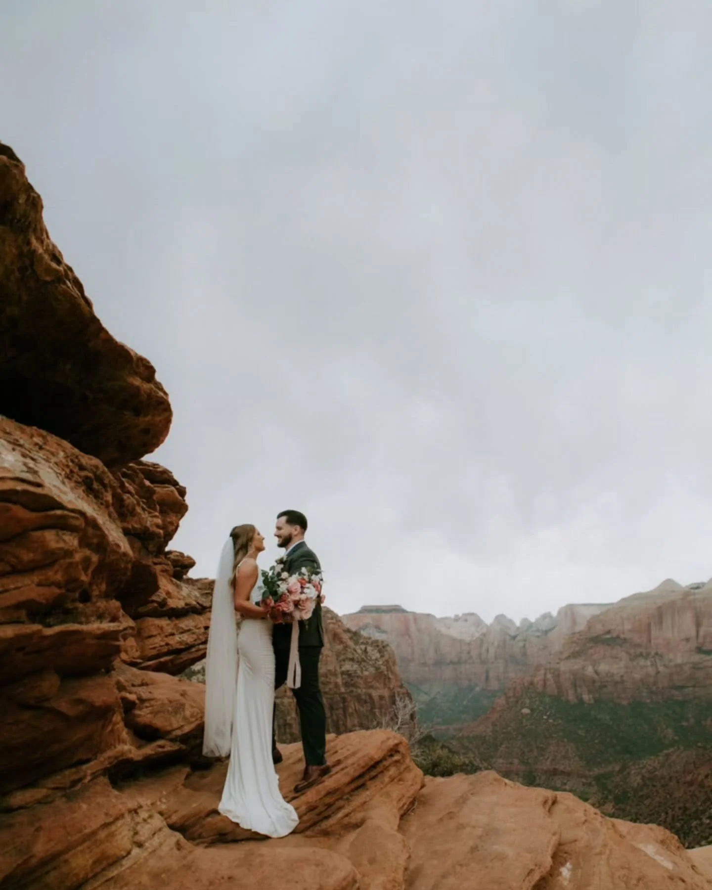 Happy anniversary to these two! I will never forget during this session we were hiding from the rainstorm 😜 it was WILD!!!! but worth it 📸✨️

#zionnationalpark #zionweddingphotographer  #zionelopementphotographers