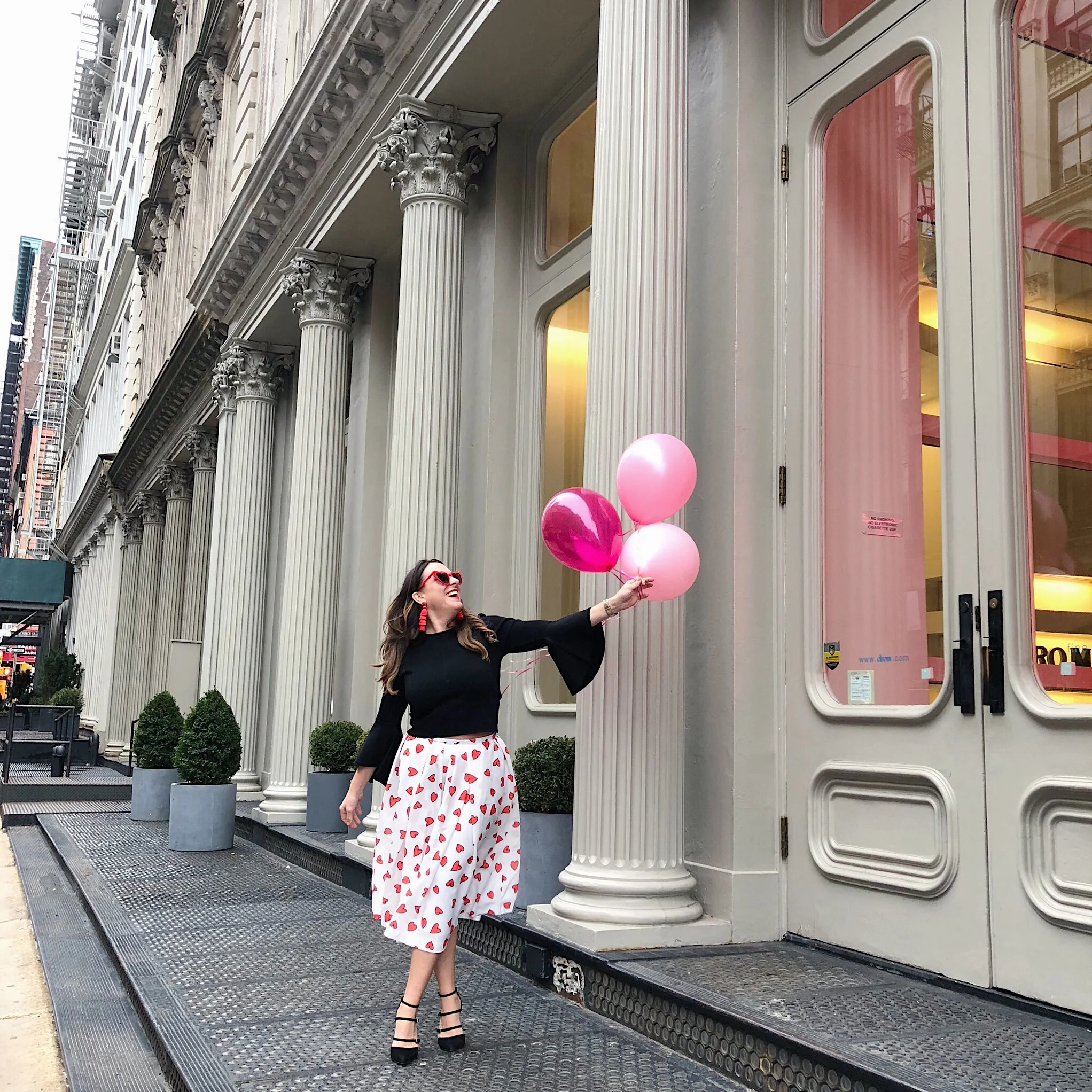 Outfit Details: Mignon Doo Heart Skirt , Red Heart Sunglasses , Similar Baublebar Earrings , Similar Eliza J Top , Similar Pumps